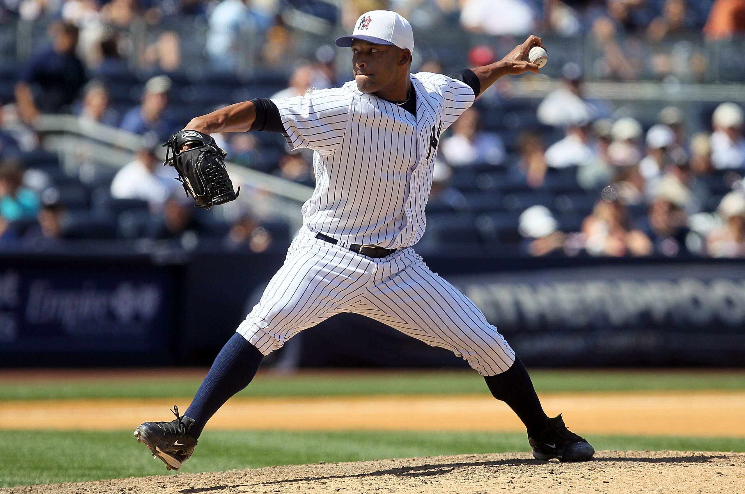 NEW YORK - JULY 04:  Damaso Marte #43 of the New York Yankees delivers a pitch against the Toronto Blue Jays on July 4, 2010 at Yankee Stadium in the Bronx borough of New York City.  (Photo by Jim McIsaac/Getty Images)