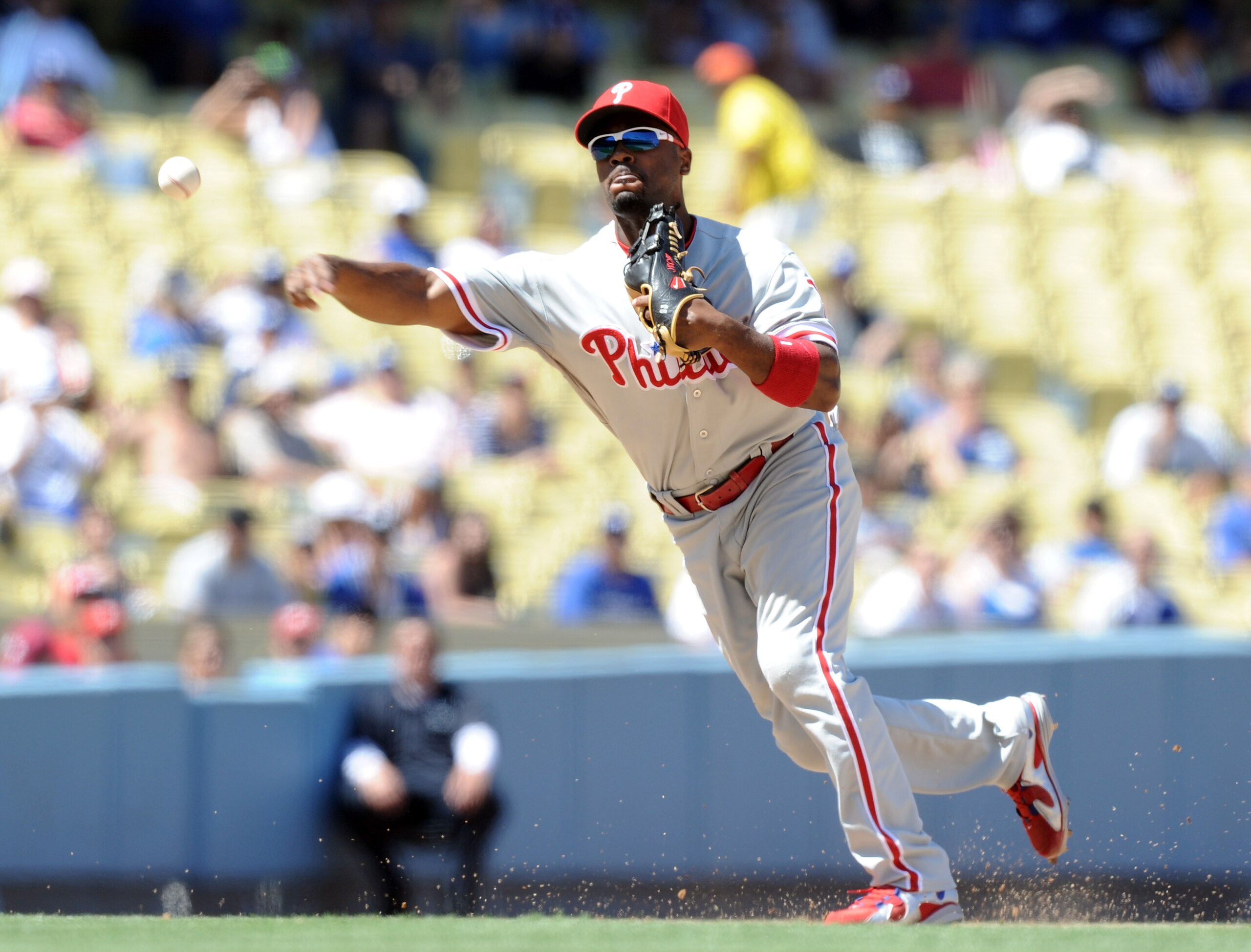 LOS ANGELES, CA - SEPTEMBER 01:  Jimmy Rollins #11 of the Philadelphia Phillies throws to first for an out against the Los Angeles Dodgers at Dodger Stadium on September 1, 2010 in Los Angeles, California.  (Photo by Harry How/Getty Images)