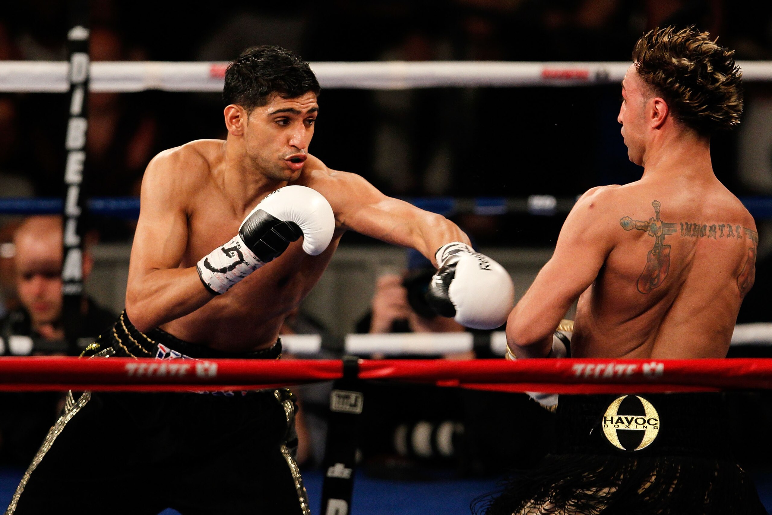 NEW YORK - MAY 15:  Amir Khan (L) of Great Britain hits Paulie Malignaggi during the WBA light welterweight title fight at Madison Square Garden on May 15, 2010 in New York City.  (Photo by Chris Trotman/Getty Images)
