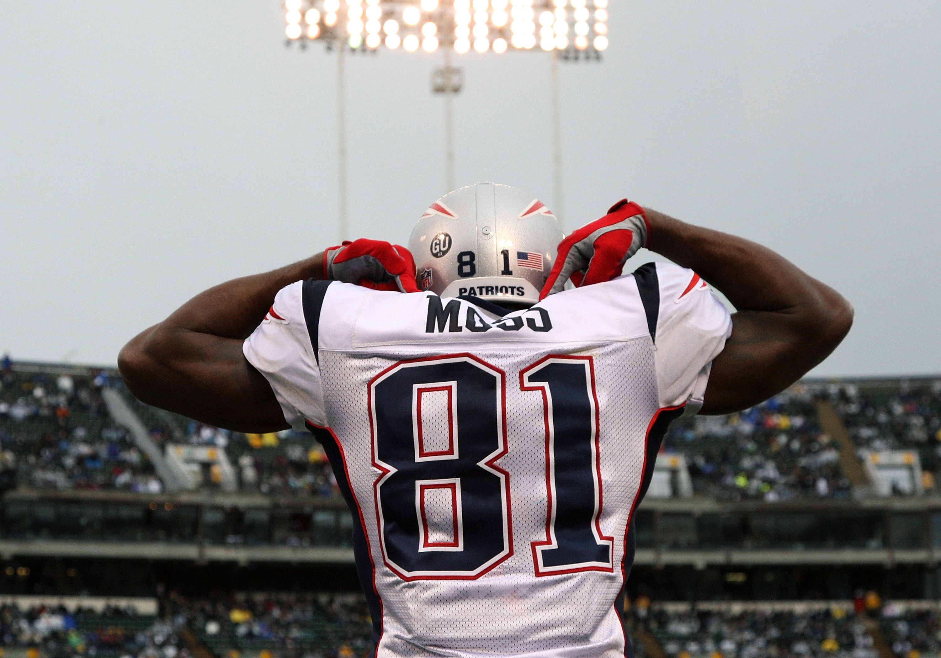 OAKLAND, CA - DECEMBER 14: Randy Moss #81 of the New England Patriots celeberates after scoring a touchdown against the Oakland Raiders during an NFL game on December 14, 2008 at the Oakland-Alameda County Coliseum in Oakland, California.  (Photo by Jed J