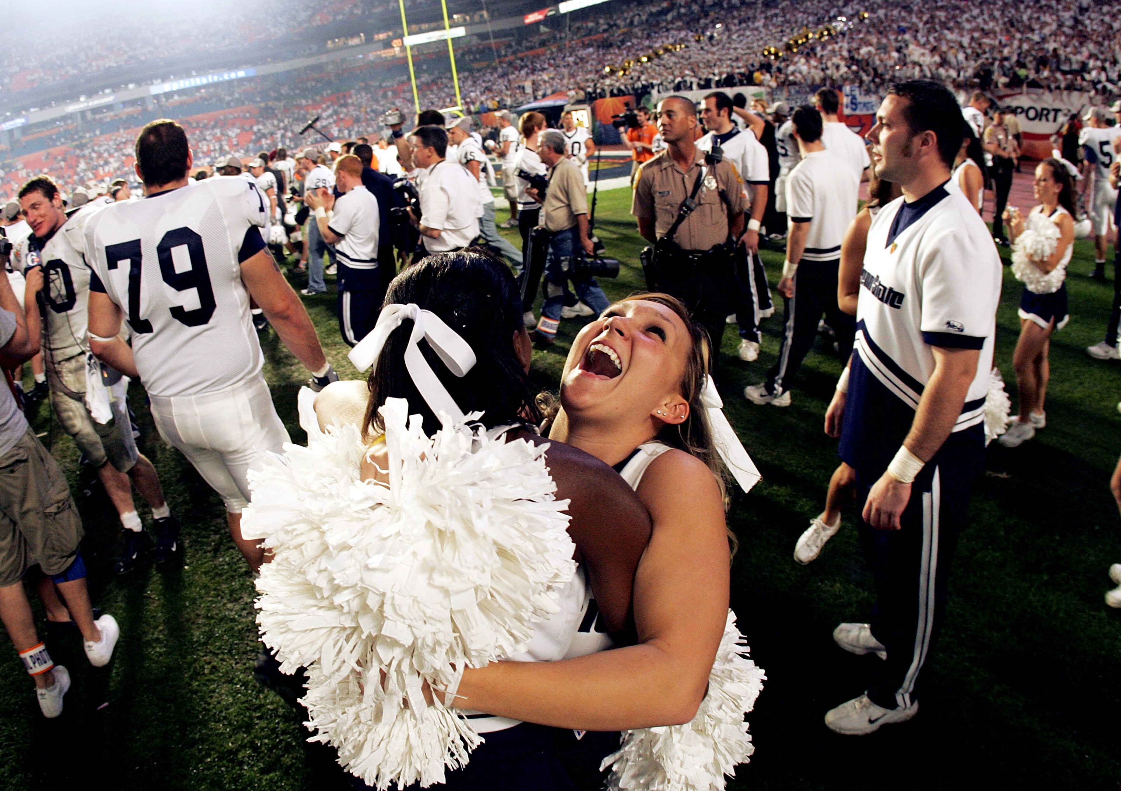 MIAMI - JANUARY 4: Cheerleader Genevieve Evans of the Penn State Nittany Lions celebrates after victory over the Florida State Seminoles during the FedEx Orange Bowl on January 4, 2006 at Dolphins Stadium in Miami, Florida. Penn State defeated Florida St MIAMI - JANUARY 4: Cheerleader Genevieve Evans of the Penn State Nittany Lions celebrates after victory over the Florida State Seminoles during the FedEx Orange Bowl on January 4, 2006 at Dolphins Stadium in Miami, Florida. Penn State defeated Florida St