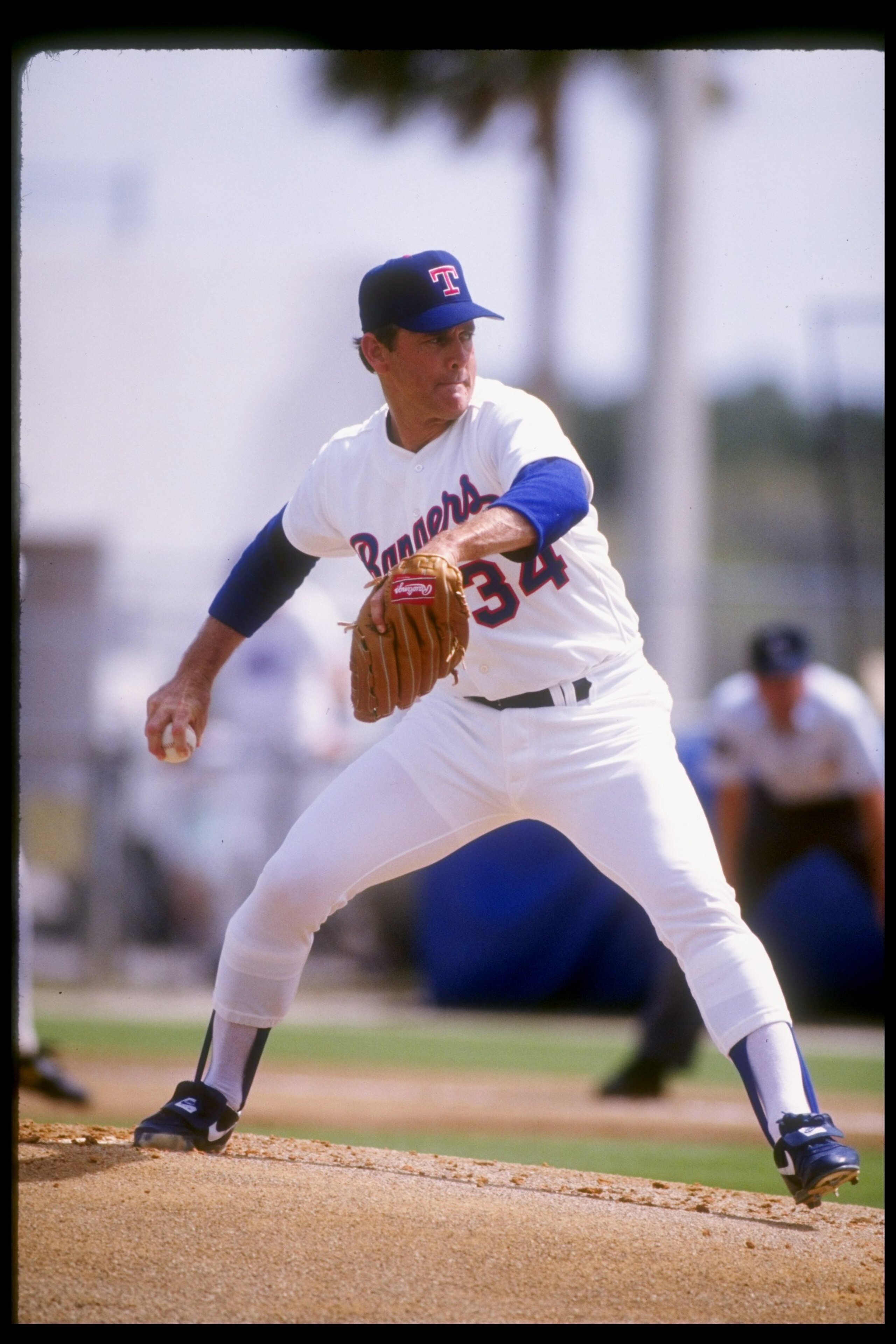 1992:  Pitcher Nolan Ryan of the Texas Rangers winds up for the pitch during spring training. Mandatory Credit: Jonathan Daniel  /Allsport