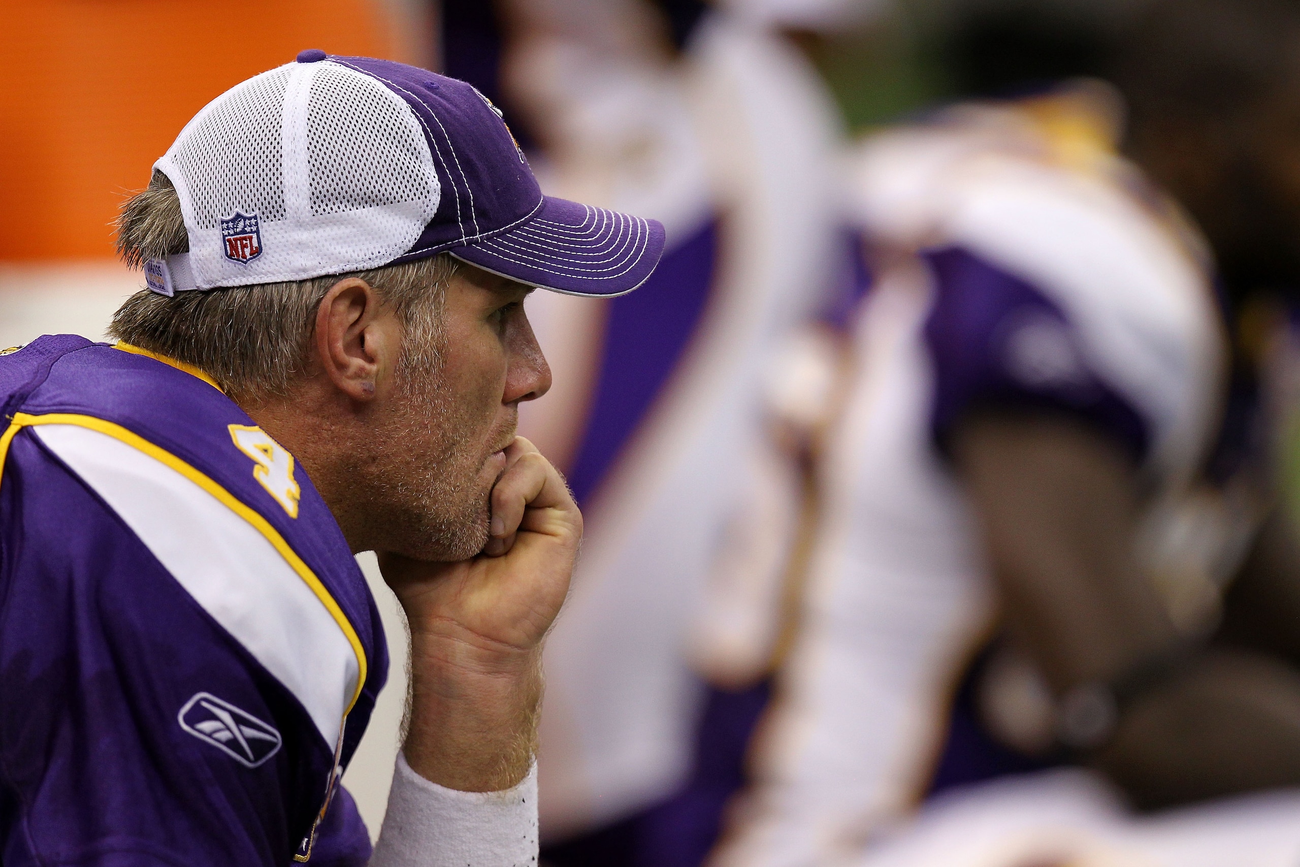 NEW ORLEANS - SEPTEMBER 09:  Quarterback Brett Favre #4 of the Minnesota Vikings sits on the bench dejected late in the fourth quarter against the New Orleans Saints at Louisiana Superdome on September 9, 2010 in New Orleans, Louisiana. The Saints won 14-