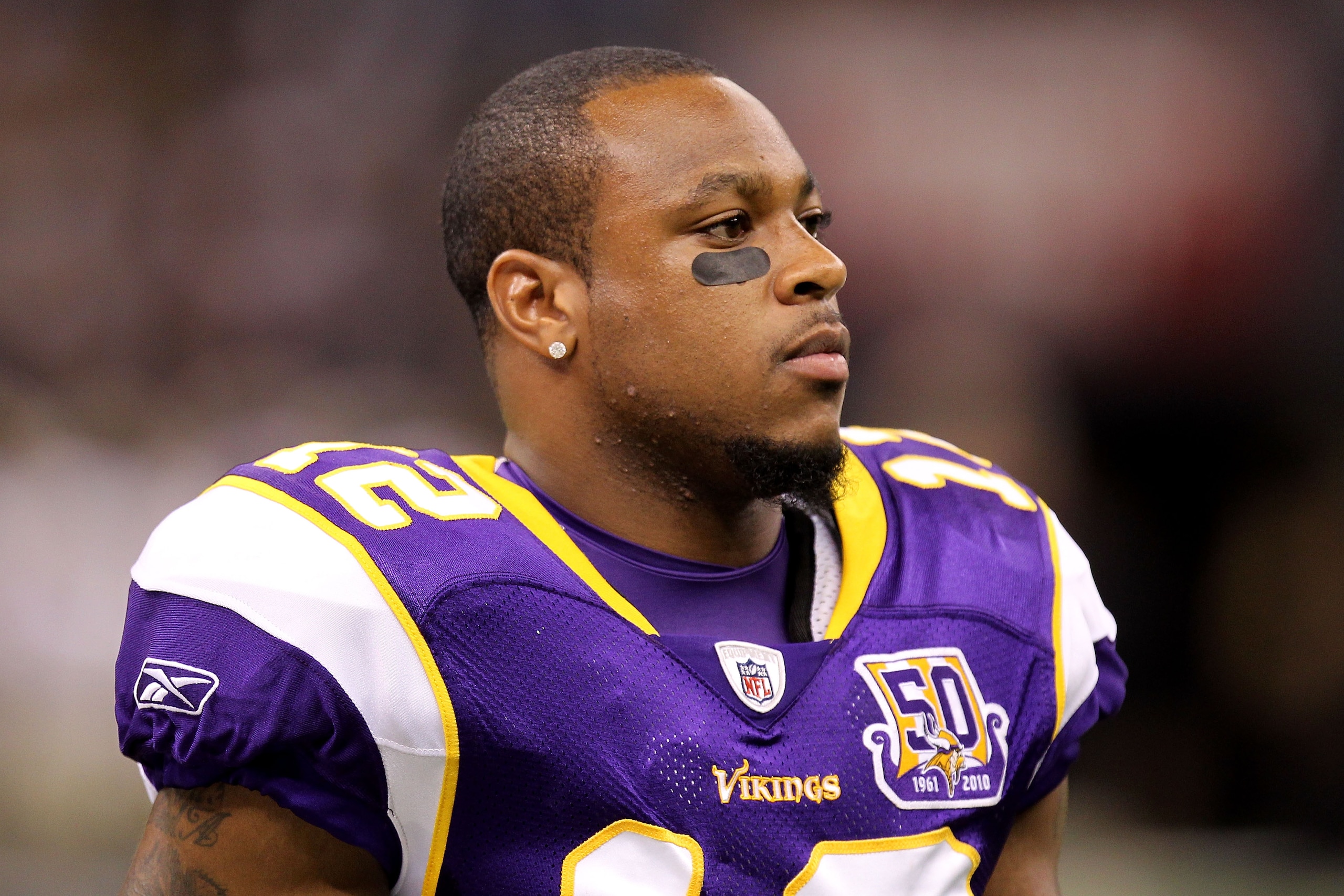NEW ORLEANS - SEPTEMBER 09:  Percy Harvin #12 of  the Minnesota Vikings looks on against the New Orleans Saints at Louisiana Superdome on September 9, 2010 in New Orleans, Louisiana.  (Photo by Ronald Martinez/Getty Images)
