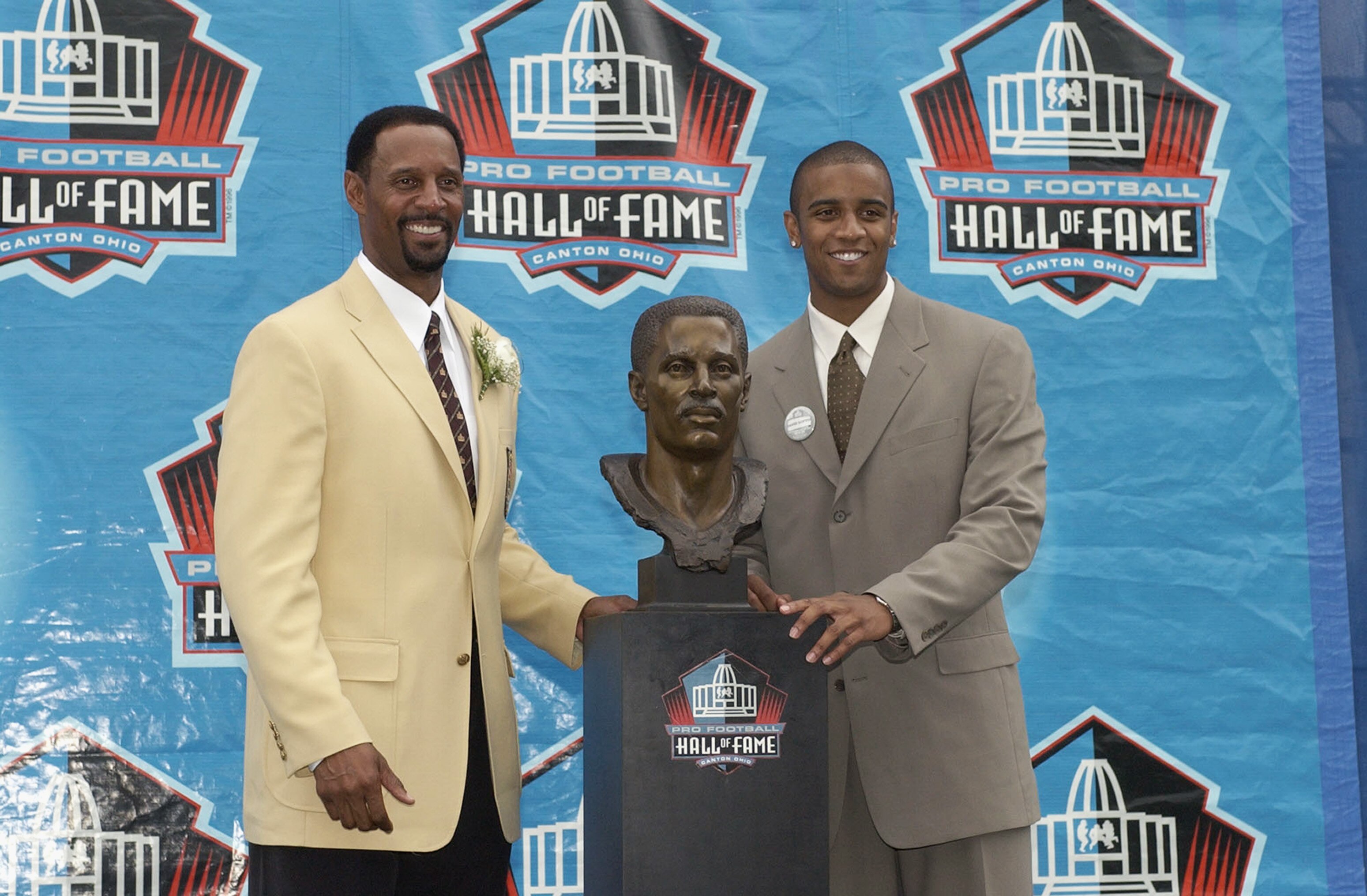 CANTON, OH - AUGUST 3:  Pro Football Hall of Fame inductee James Lofton (L) poses with his son and presenter David Lofton during the 2003 NFL Hall of Fame Induction ceremony on August 3, 2003 in Canton, Ohio.  (Photo by David Maxwell/Getty Images)