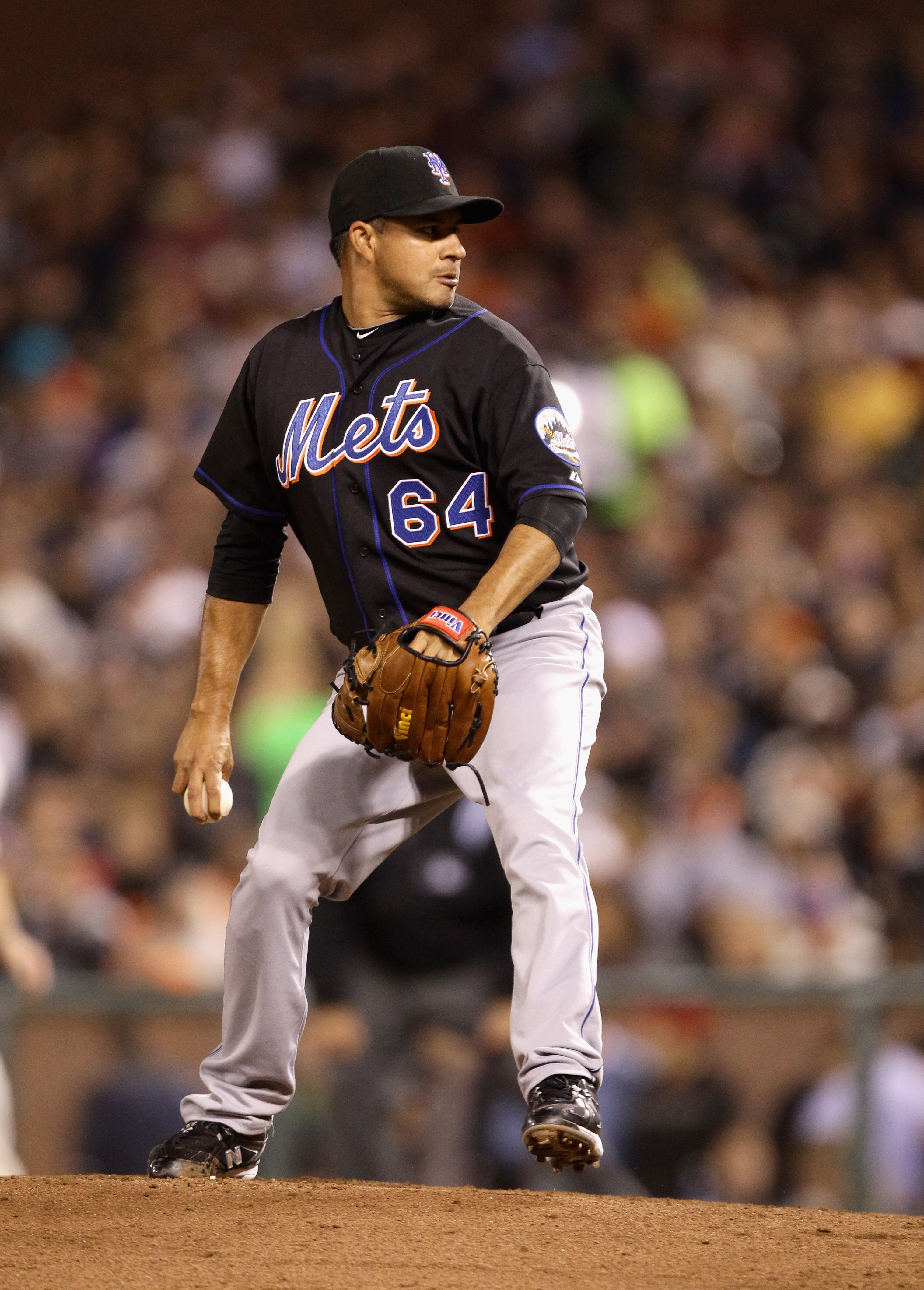 SAN FRANCISCO - JULY 15:  Elmer Dessens #64 of the New York Mets pitches against the San Francisco Giants at AT&T Park on July 15, 2010 in San Francisco, California.  (Photo by Ezra Shaw/Getty Images)