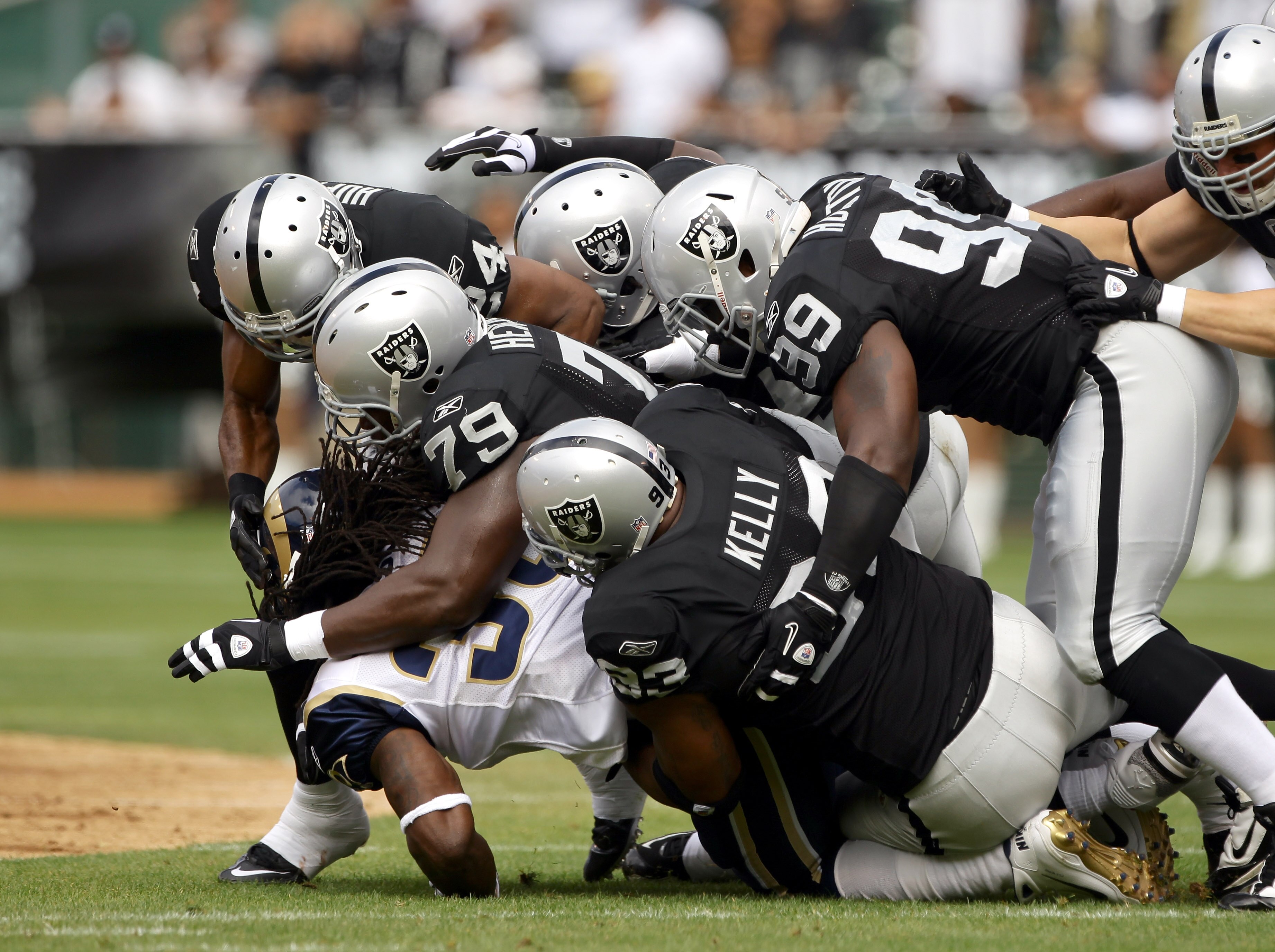 OAKLAND, CA - SEPTEMBER 19:  Steven Jackson #39 of the St. Louis Rams is tackled by the Oakland Raiders defense at the Oakland-Alameda County Coliseum on September 19, 2010 in Oakland, California.  (Photo by Ezra Shaw/Getty Images)