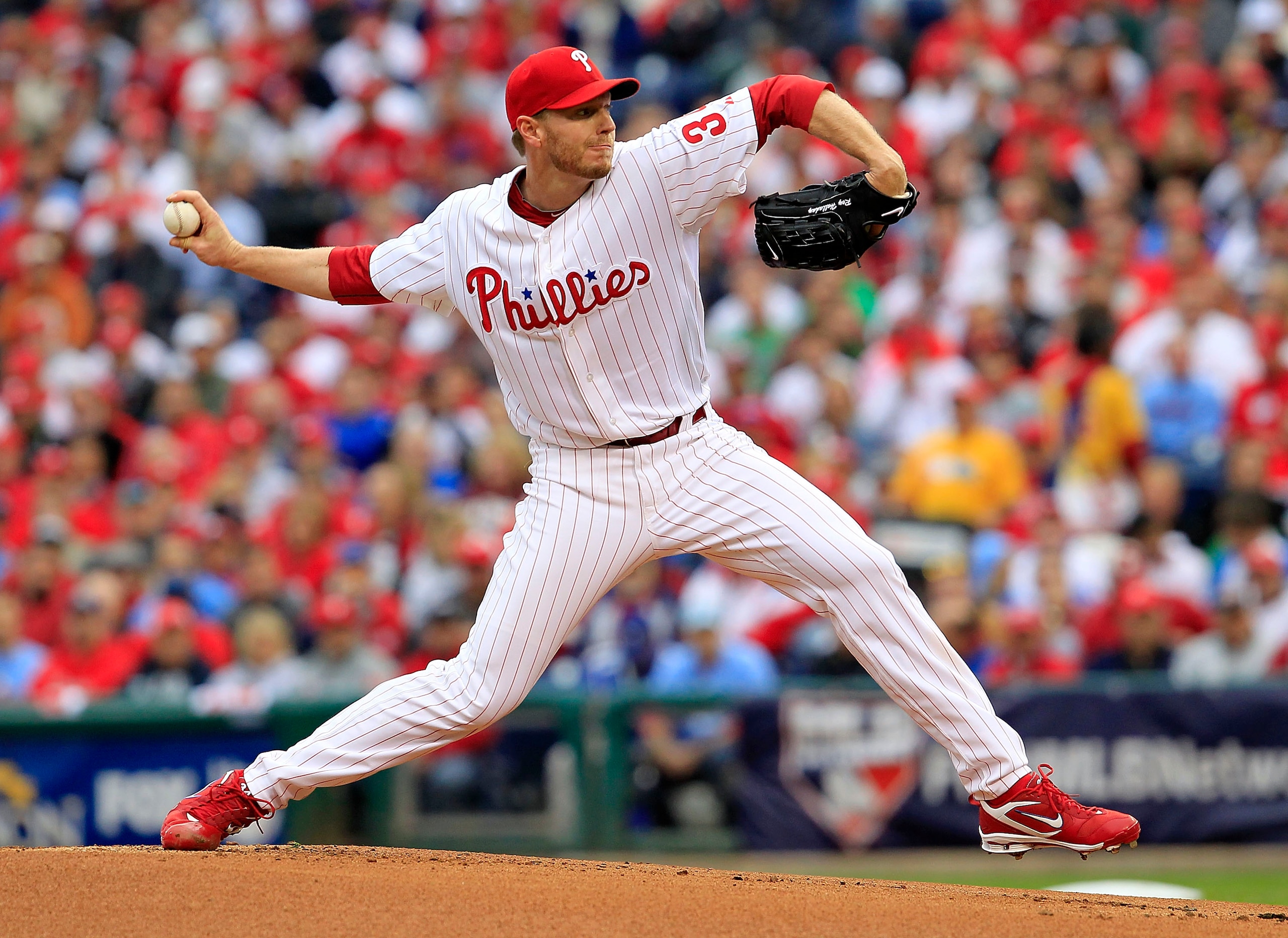 PHILADELPHIA - OCTOBER 06:  Roy Halladay #34 of the Philadelphia Phillies delivers in Game 1 of the NLDS against the Cincinnati Reds at Citizens Bank Park on October 6, 2010 in Philadelphia, Pennsylvania.  (Photo by Chris Trotman/Getty Images)