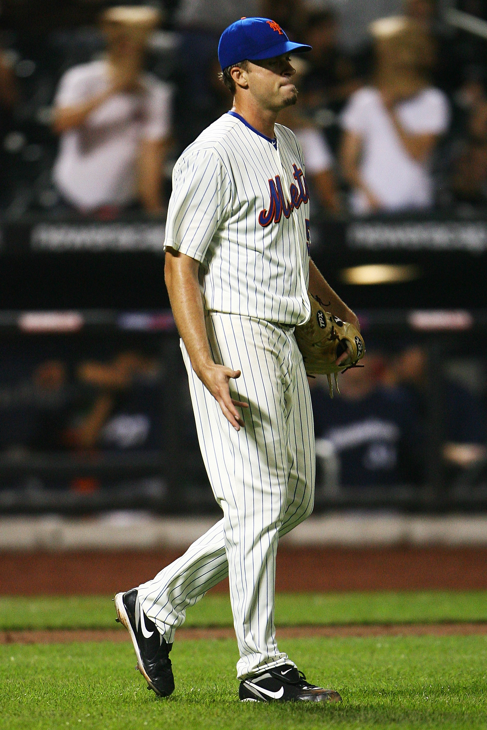 NEW YORK - SEPTEMBER 30: Sean Green #30 of the New York Mets walks back to the mound in the ninth inning during their game against the Milwaukee Brewers on September 30, 2010 at Citi Field in the Flushing neighborhood of the Queens borough of New York Cit