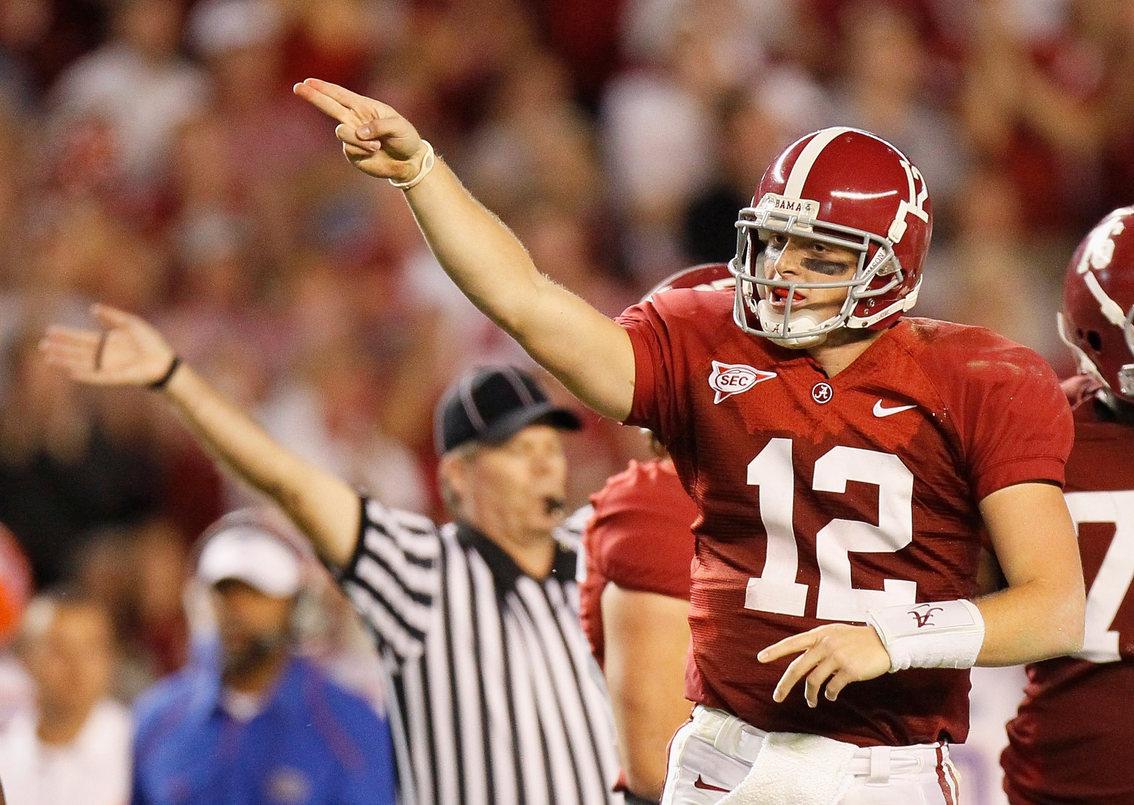 TUSCALOOSA, AL - OCTOBER 02:  Quarterback Greg McElroy #12 of the Alabama Crimson Tide signals a first down after he scrambled upfield against the Florida Gators at Bryant-Denny Stadium on October 2, 2010 in Tuscaloosa, Alabama.  (Photo by Kevin C. Cox/Ge
