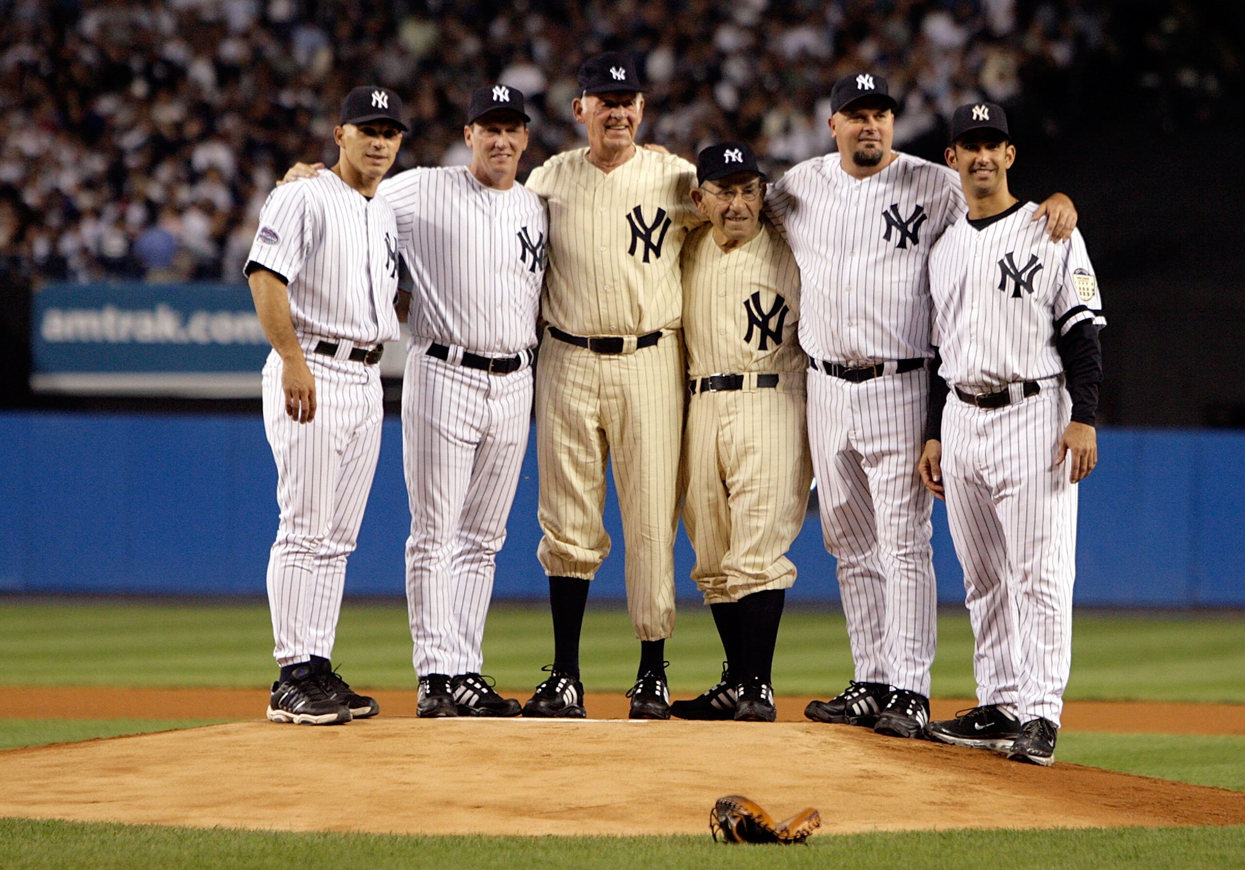 NEW YORK - SEPTEMBER 21:  (L-R) Joe Girardi, David Cone, Don Larsen, Yogi Berra, David Wells and Jorge Posada stand on the mound during a pregame ceremony prior to the start of the last regular season game at Yankee Stadium between the Baltimore Orioles a