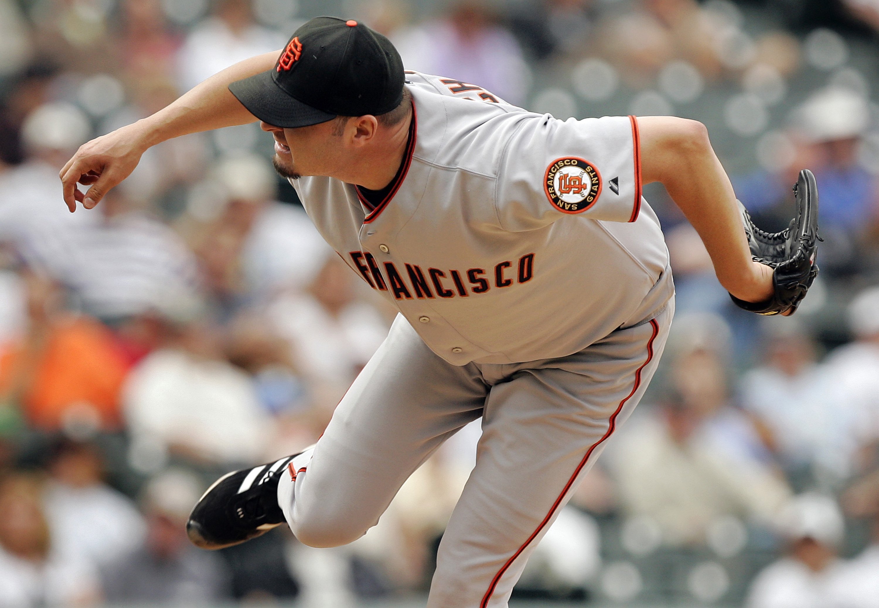 DENVER - SEPTEMBER 20:  Starting pitcher Jason Schmidt of the San Francisco Giants follows through on a pitch for a walk after giving up a triple in the fifth inning on September 20, 2006 at Coors Field in Denver, Colorado. The Giants defeated the Rockies