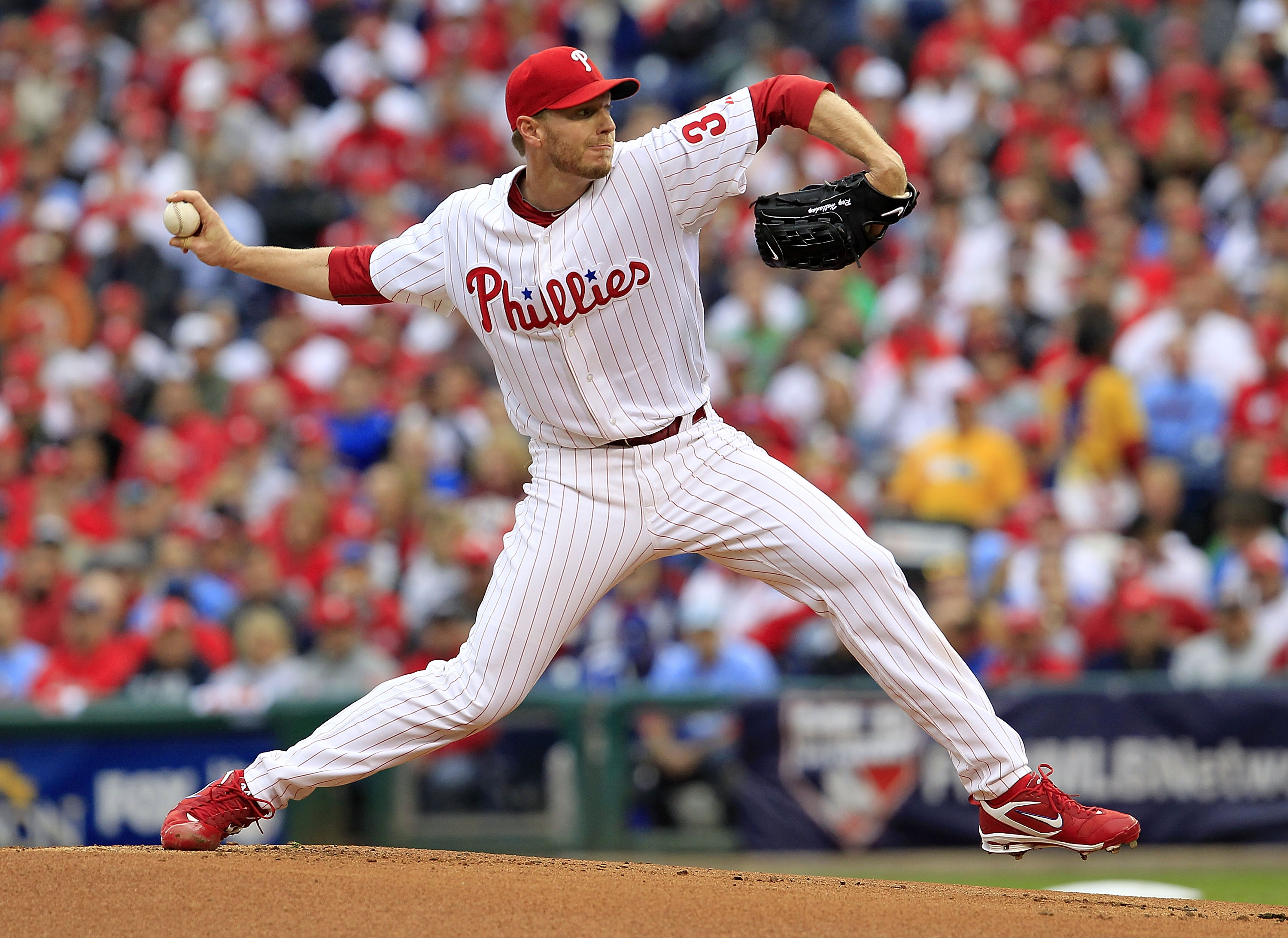 PHILADELPHIA - OCTOBER 06:  Roy Halladay #34 of the Philadelphia Phillies delivers in Game 1 of the NLDS against the Cincinnati Reds at Citizens Bank Park on October 6, 2010 in Philadelphia, Pennsylvania.  (Photo by Chris Trotman/Getty Images)