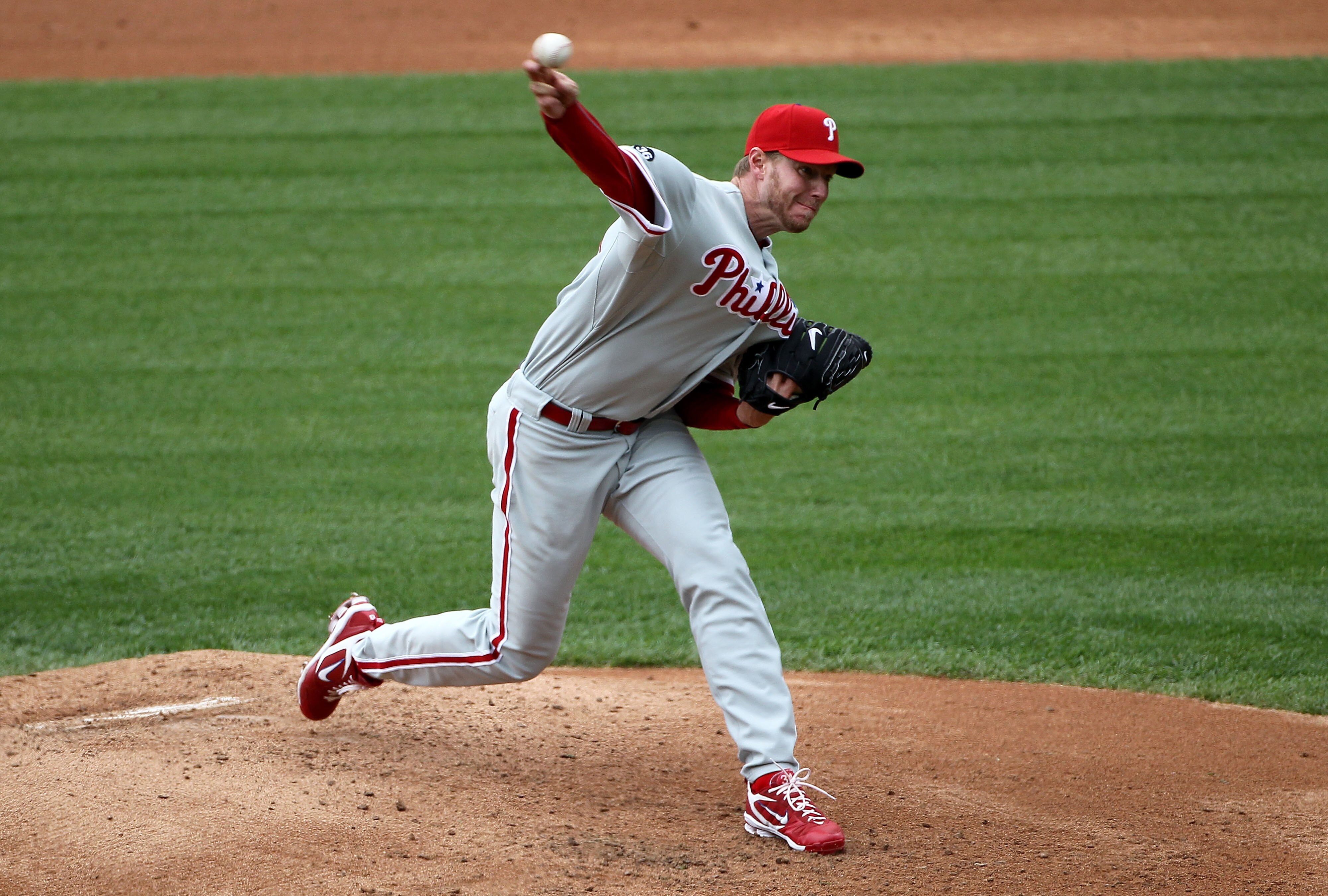 DENVER - MAY 12:  Starting pitcher Roy Halladay #34 of the Philadelphia Phillies delivers against the Colorado Rockies at Coors Field on May 12, 2010 in Denver, Colorado. The Rockies defeated the Phillies 4-3 in 10 innings.  (Photo by Doug Pensinger/Getty