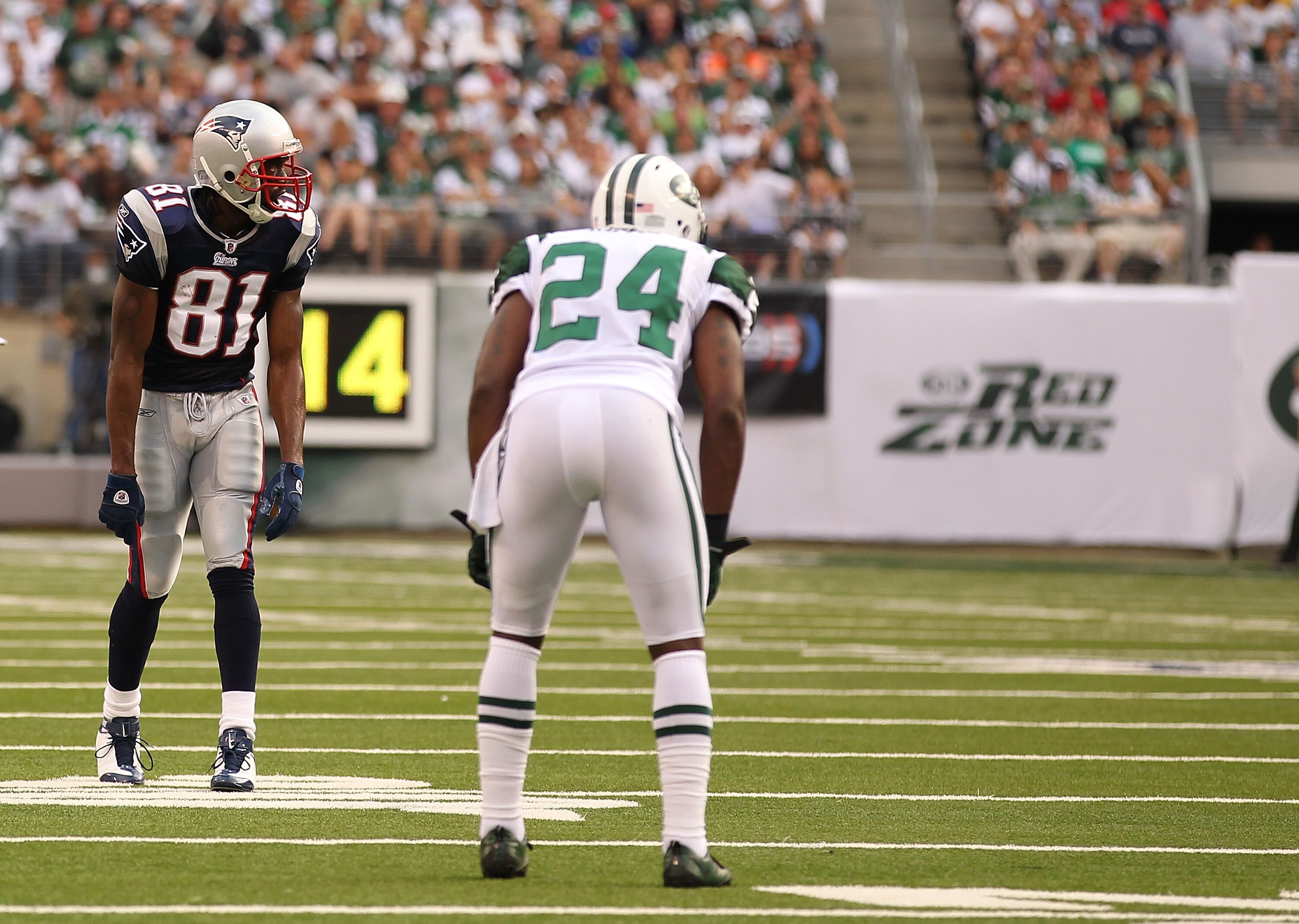 EAST RUTHERFORD, NJ - SEPTEMBER 19:  Darrelle Revis #24 of the New York Jets defends against Randy Moss #81 of the New England Patriots during their  game on September 19, 2010 at the New Meadowlands Stadium  in East Rutherford, New Jersey.  (Photo by Al
