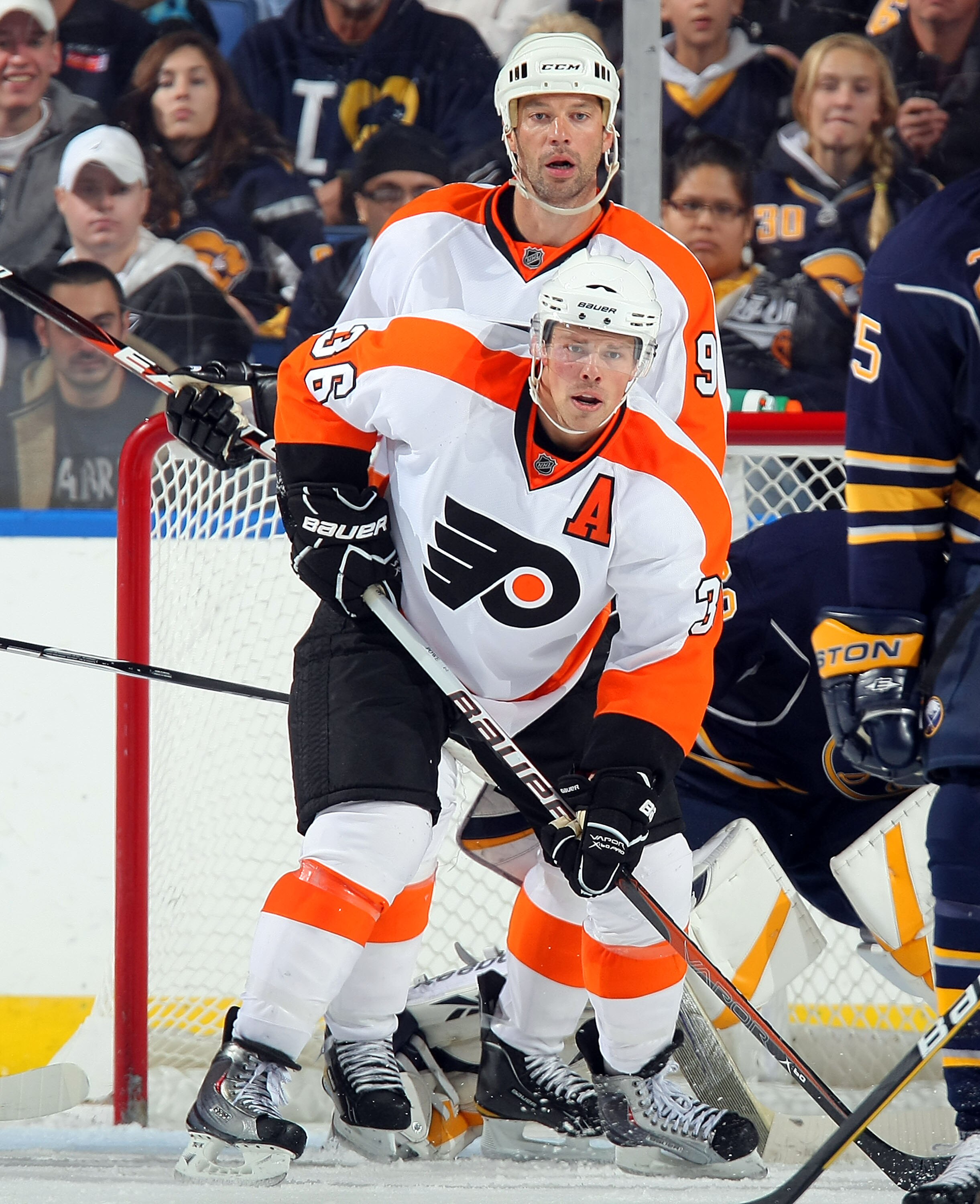 BUFFALO - OCTOBER 3:  Bill Guerin #9 and Darroll Powe #36 both of the Philadelphia Flyers set up in front of the Buffalo Sabres net during their NHL game at HSBC Arena October 3, 2010 in Buffalo, New York. The Sabres won 9-3. (Photo By Dave Sandford/Getty
