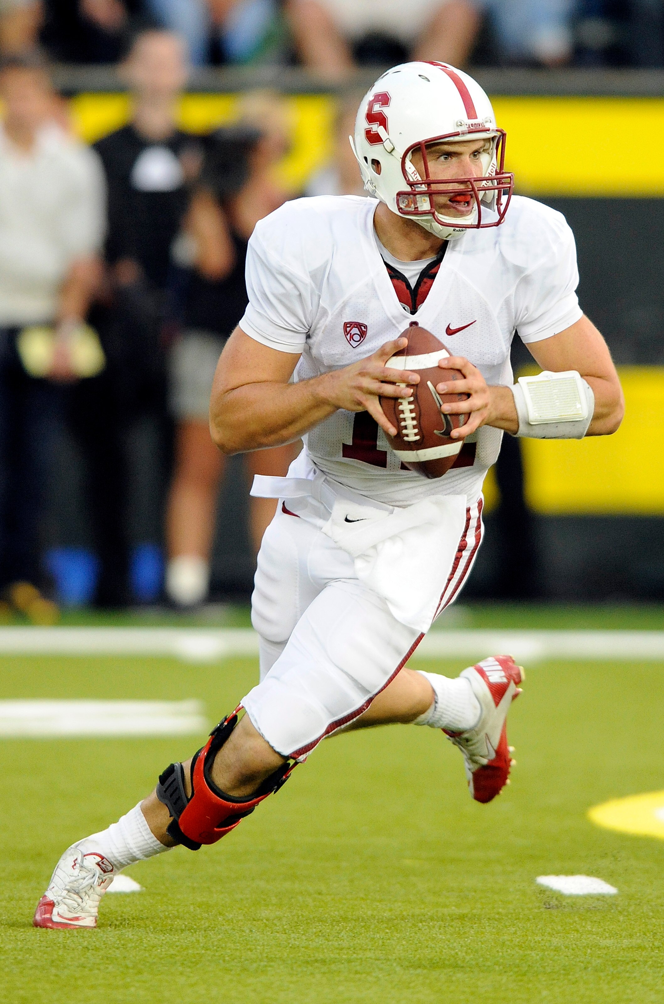EUGENE, OR - OCTOBER 2: Quarterback Andrew Luck #12 of the Stanford Cardinal rolls out to pass the ball in the third quarter of the game against the Oregon Ducks at Autzen Stadium on October 2, 2010 in Eugene, Oregon. Oregon won the game 52-31. (Photo by