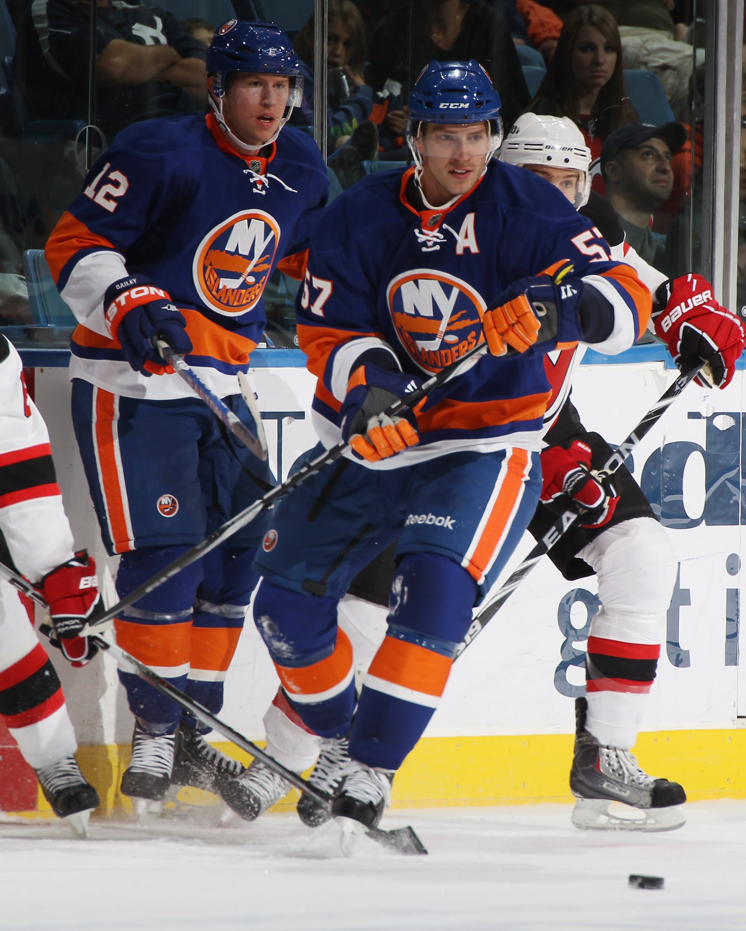 UNIONDALE, NY - OCTOBER 02: Blake Comeau #57 of the New York Islanders skates against the New Jersey Devils at the Nassau Veterans Memorial Coliseum on October 2, 2010 in Uniondale, New York. The Islanders defeated the Devils 2-1.  (Photo by Bruce Bennett