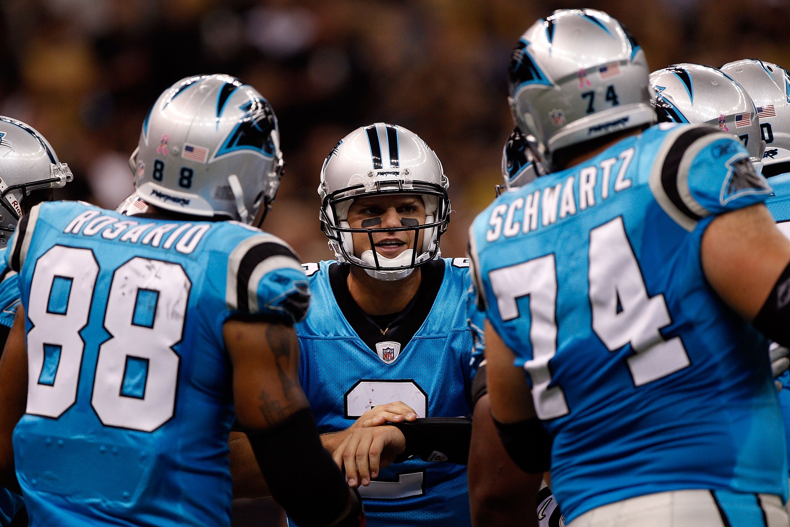 NEW ORLEANS - OCTOBER 03:  Jimmy Clausen #2 of the Carolina Panthers  calls a play in the huddle during the game against the New Orleans Saints at the Louisiana Superdome on October 3, 2010 in New Orleans, Louisiana.   The Saints defeated the Panthers 16-