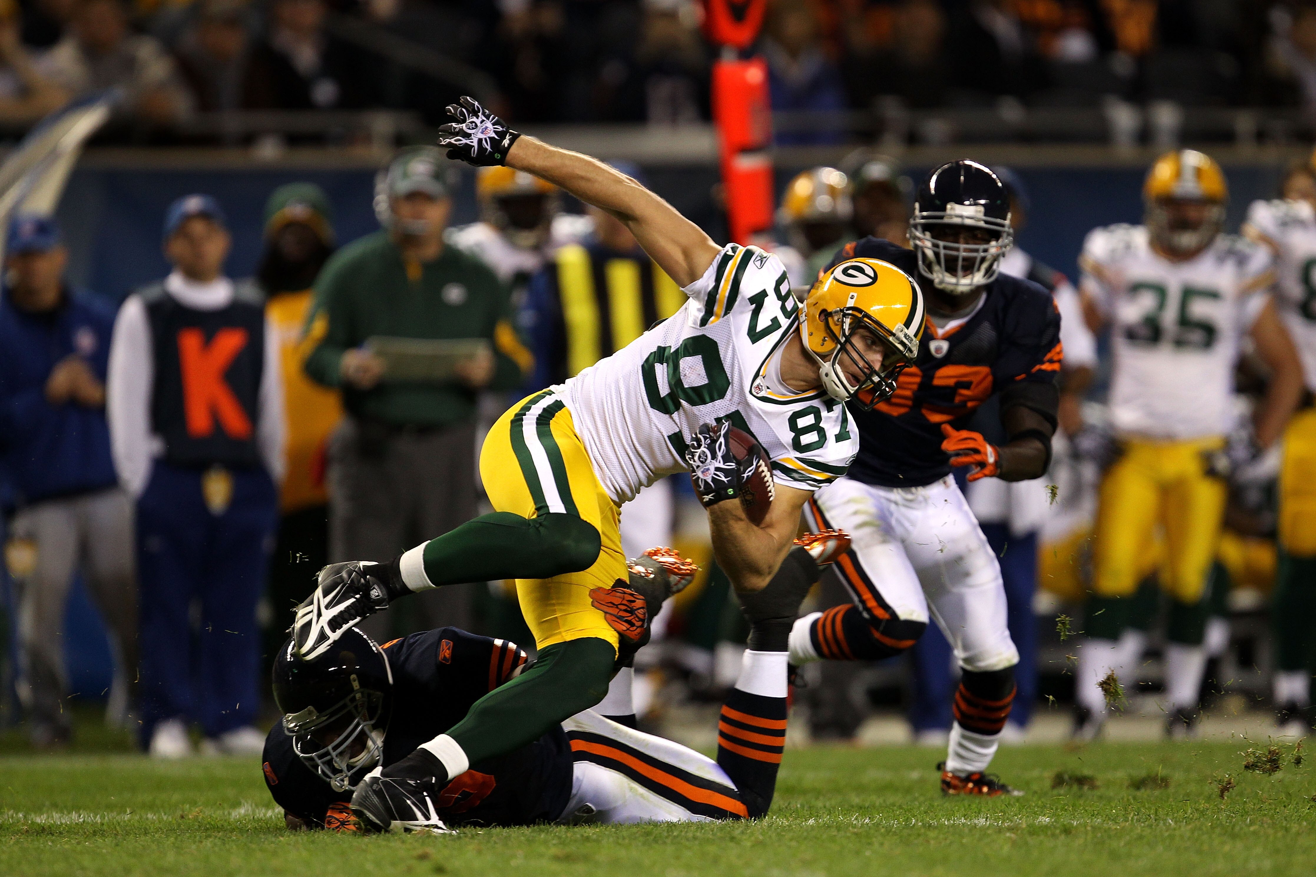 CHICAGO - SEPTEMBER 27:  Jordy Nelson #87 of the Green Bay Packers runs for yards after the catch against Lance Briggs #55 and Charles Tillman #33 of the Chicago Bears at Soldier Field on September 27, 2010 in Chicago, Illinois. The Bears won 20-17. (Phot