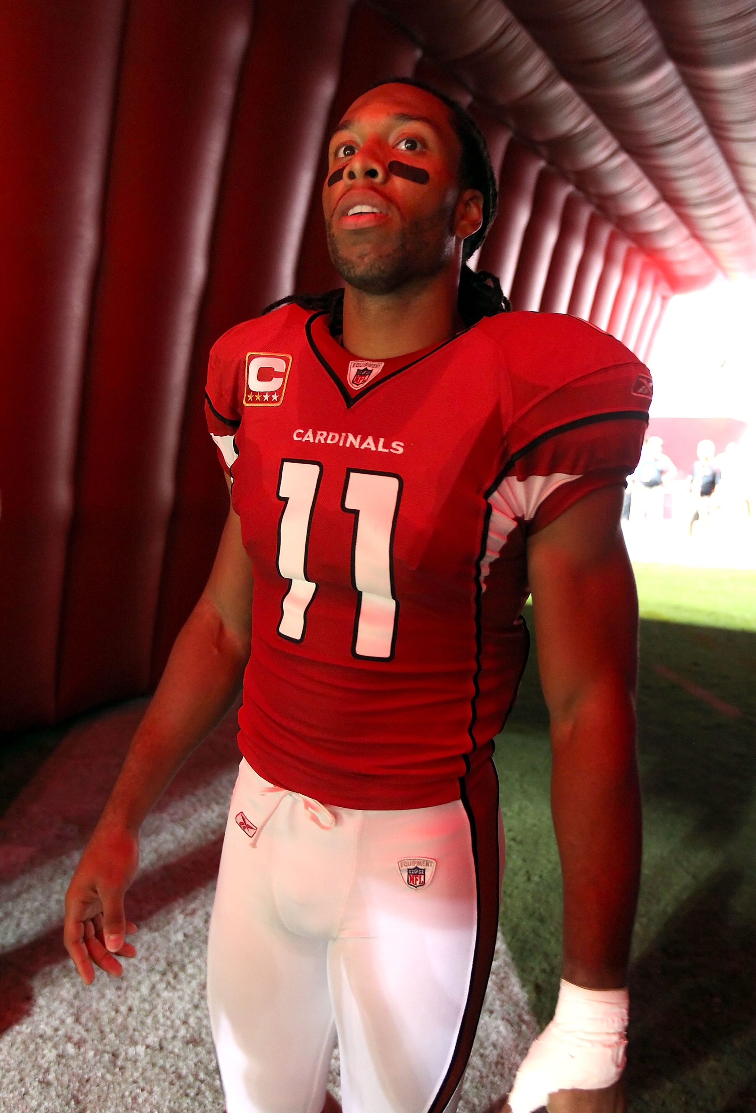 GLENDALE, AZ - SEPTEMBER 26:  Wide receiver Larry Fitzgerald #11 of the Arizona Cardinals waits to be introduced before the NFL game against the Oakland Raiders at the University of Phoenix Stadium on September 26, 2010 in Glendale, Arizona.  The Cardinal