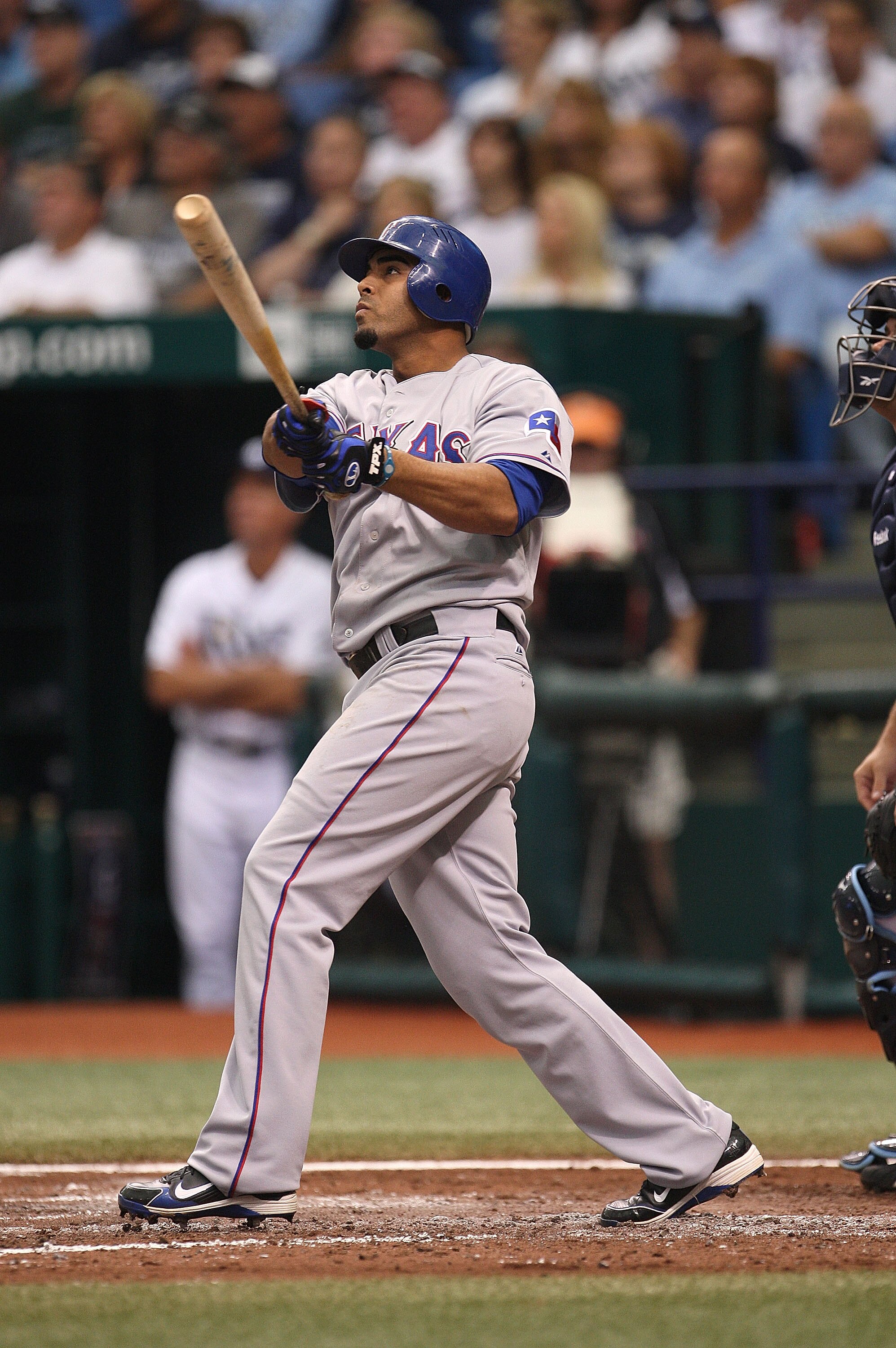 ST PETERSBURG, FL - OCTOBER 06:  6: Nelson Cruz #17 of the Texas Rangers hits a solo homerun in the third inning off pitcher David Price during Game 1 of the ALDS against the Tampa Bay Rays at Tropicana Field on October 6, 2010 in St. Petersburg, Florida.