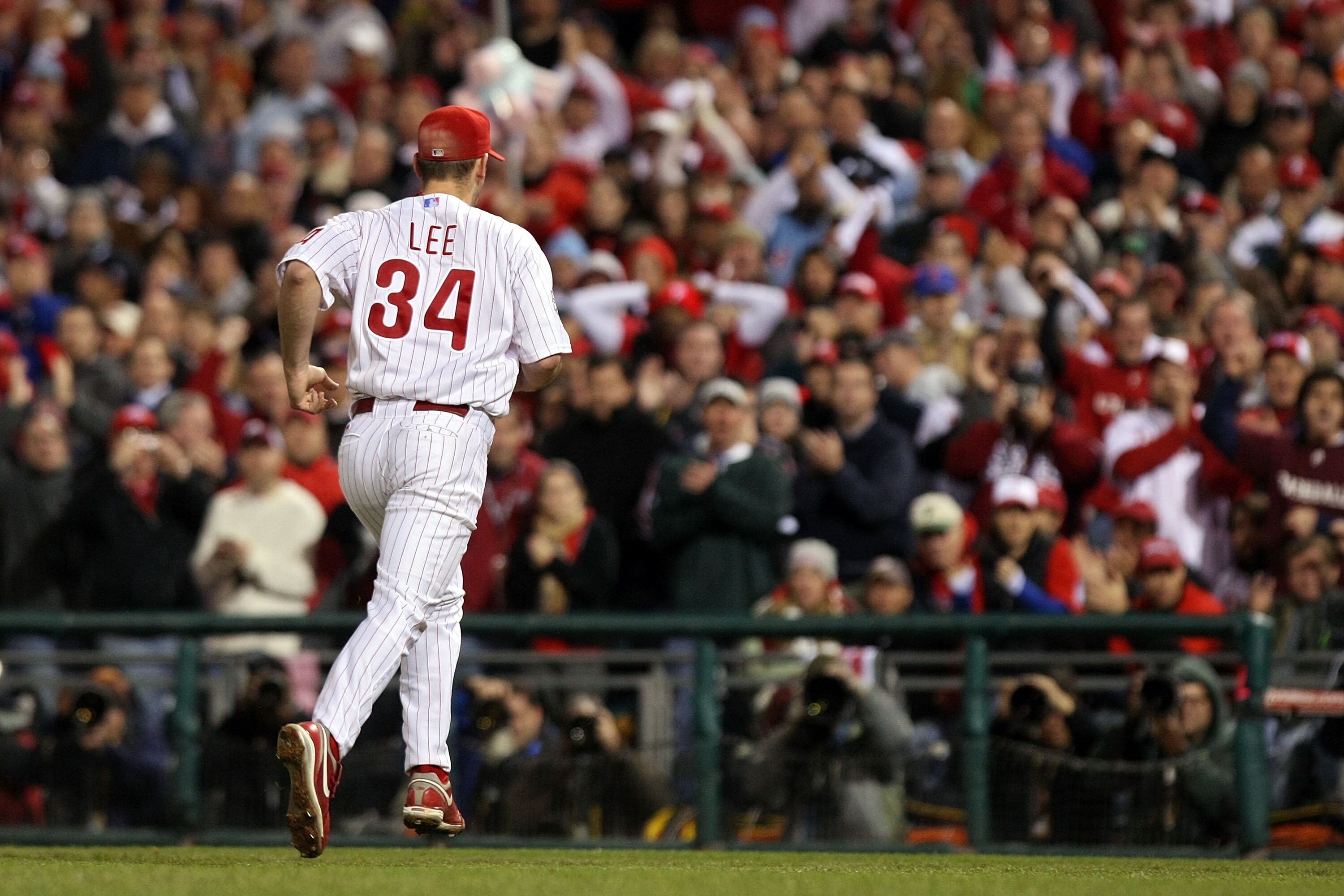 PHILADELPHIA - NOVEMBER 02:  Cliff Lee #34 of the Philadelphia Phillies runs back to the dugout after the final out in the top of the seventh inning against the New York Yankees in Game Five of the 2009 MLB World Series at Citizens Bank Park on November 2