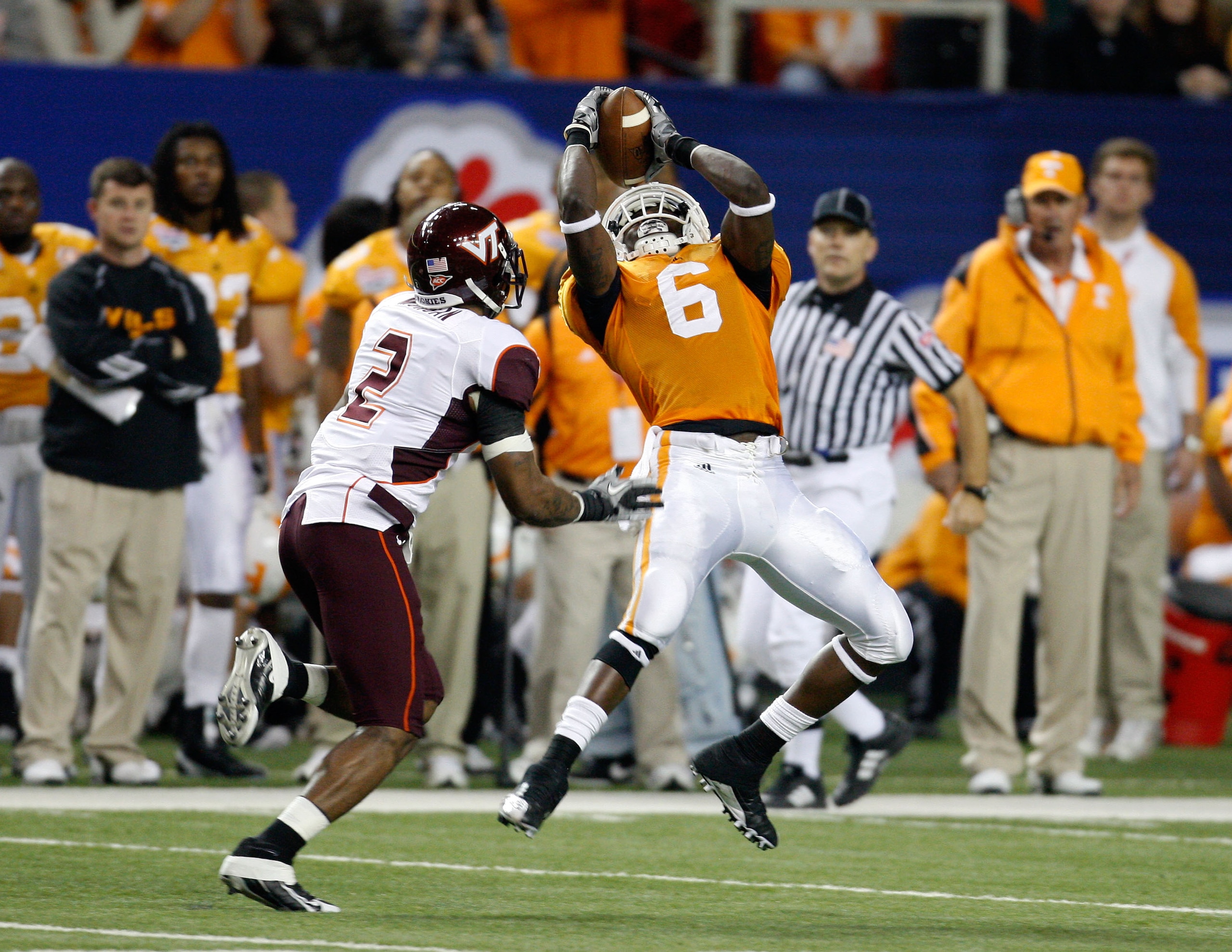 ATLANTA - DECEMBER 31: Wide receiver Denarius Moore #6 of the Tennessee Volunteers hauls in a second quarter pass while defensive back Devon Morgan #2 of the Virginia Tech Hokies tries to cover him during the Chick-Fil-A Bowl at the Georgia Dome on Decem ATLANTA - DECEMBER 31: Wide receiver Denarius Moore #6 of the Tennessee Volunteers hauls in a second quarter pass while defensive back Devon Morgan #2 of the Virginia Tech Hokies tries to cover him during the Chick-Fil-A Bowl at the Georgia Dome on Decem