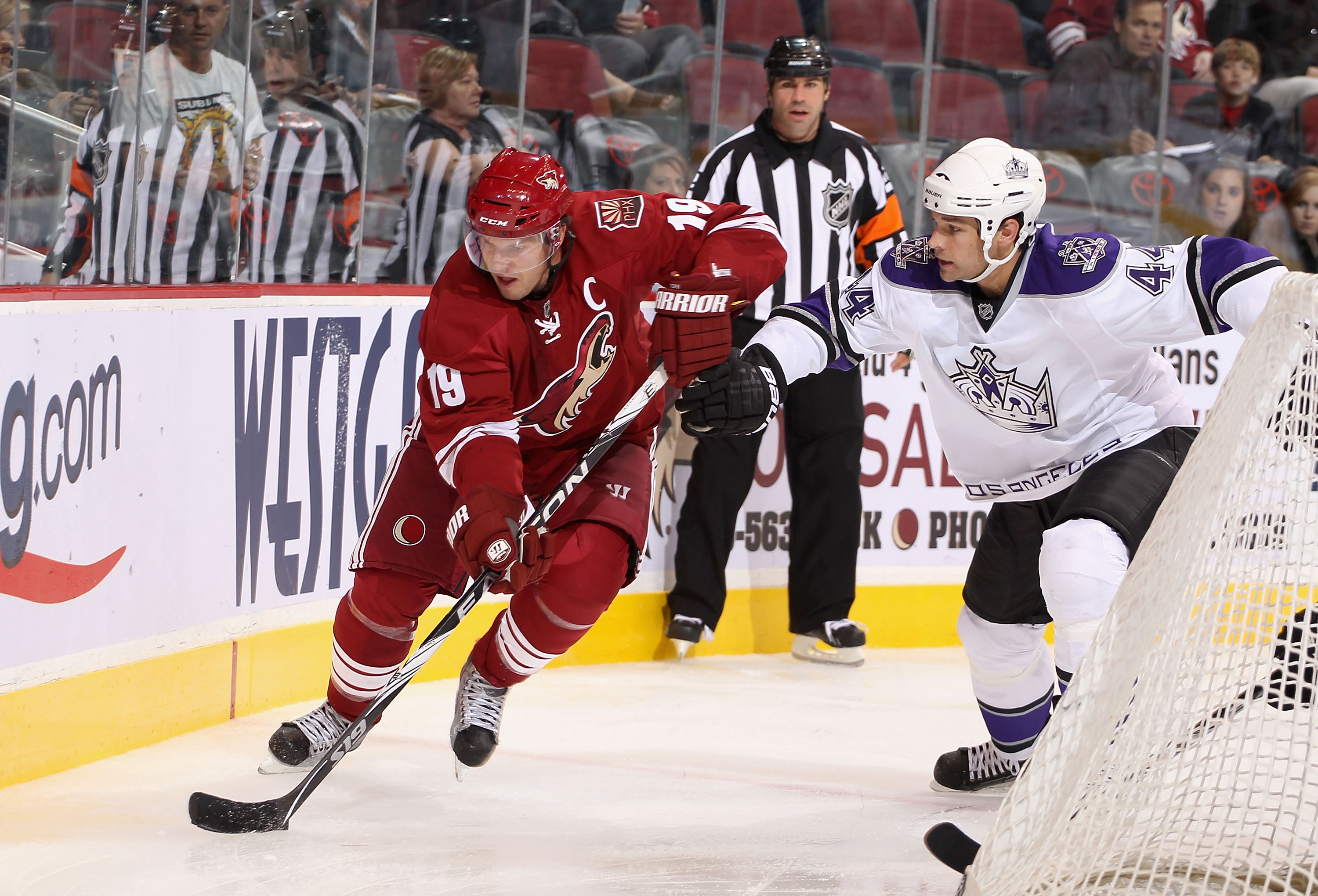 GLENDALE, AZ - SEPTEMBER 23:  Shane Doan #19 of the Phoenix Coyotes skates with the puck during the preseason NHL game against the Los Angeles Kings at Jobing.com Arena on September 23, 2010 in Glendale, Arizona.  The Coyotes defeated the Kings 2-1 in ove