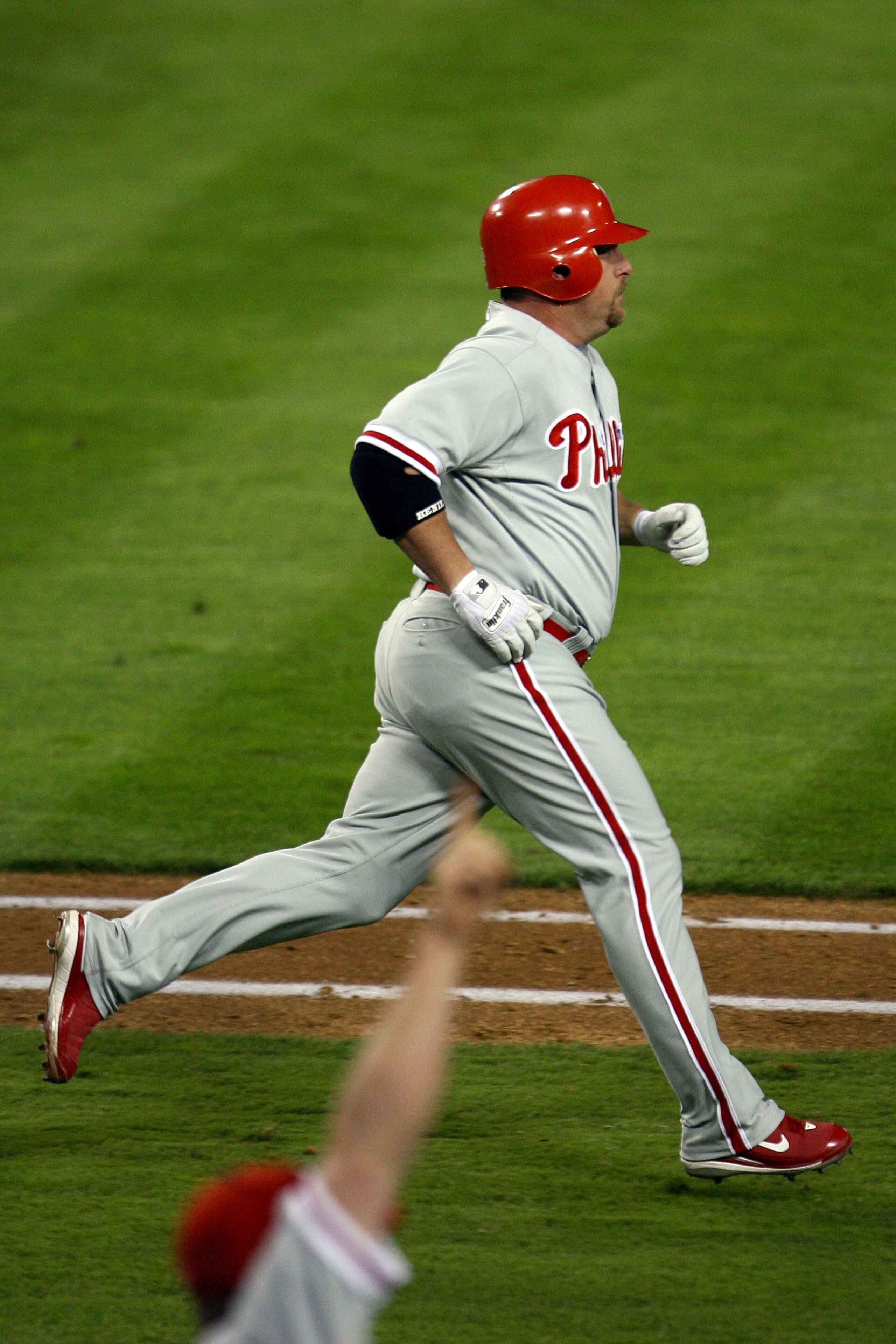 LOS ANGELES, CA - OCTOBER 13:  Matt Stairs #12 of the Philadelphia Phillies runs the bases as he hit a two-run pinch hit home run in the eighth inning off Jonathan Broxton #51 of the Los Angeles Dodgers to take a two-run lead in game Game Four of the Nati