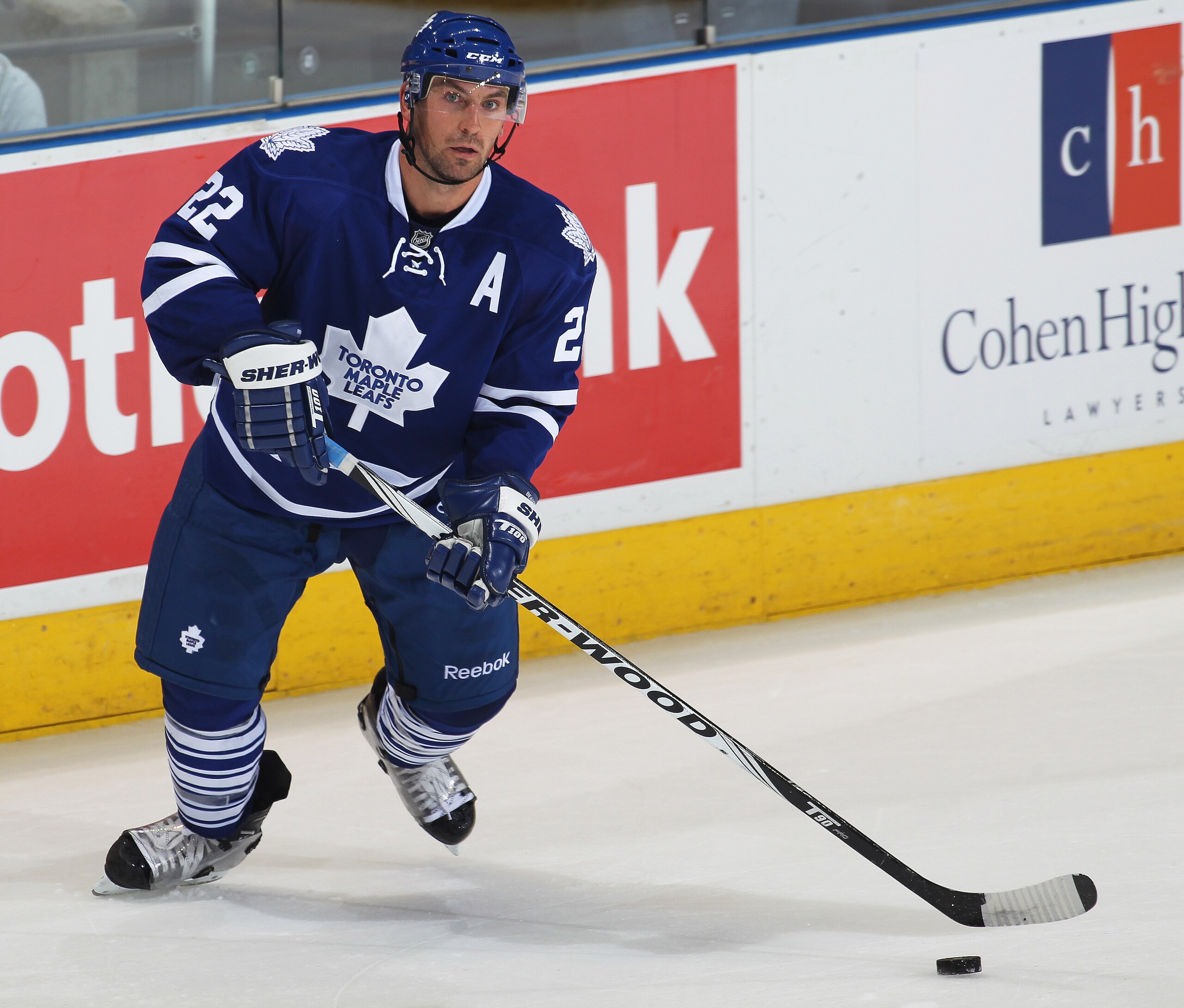 LONDON,ON - SEPTEMBER 23: Francois Beauchemin #22 of the Toronto Maple Leafs skates with the puck in a pre-season game against the Philadelphia Flyers on September 23,2010 at the John Labatt Centre in London, Ontario. The Leafs defeated the Flyers 3-2 in 