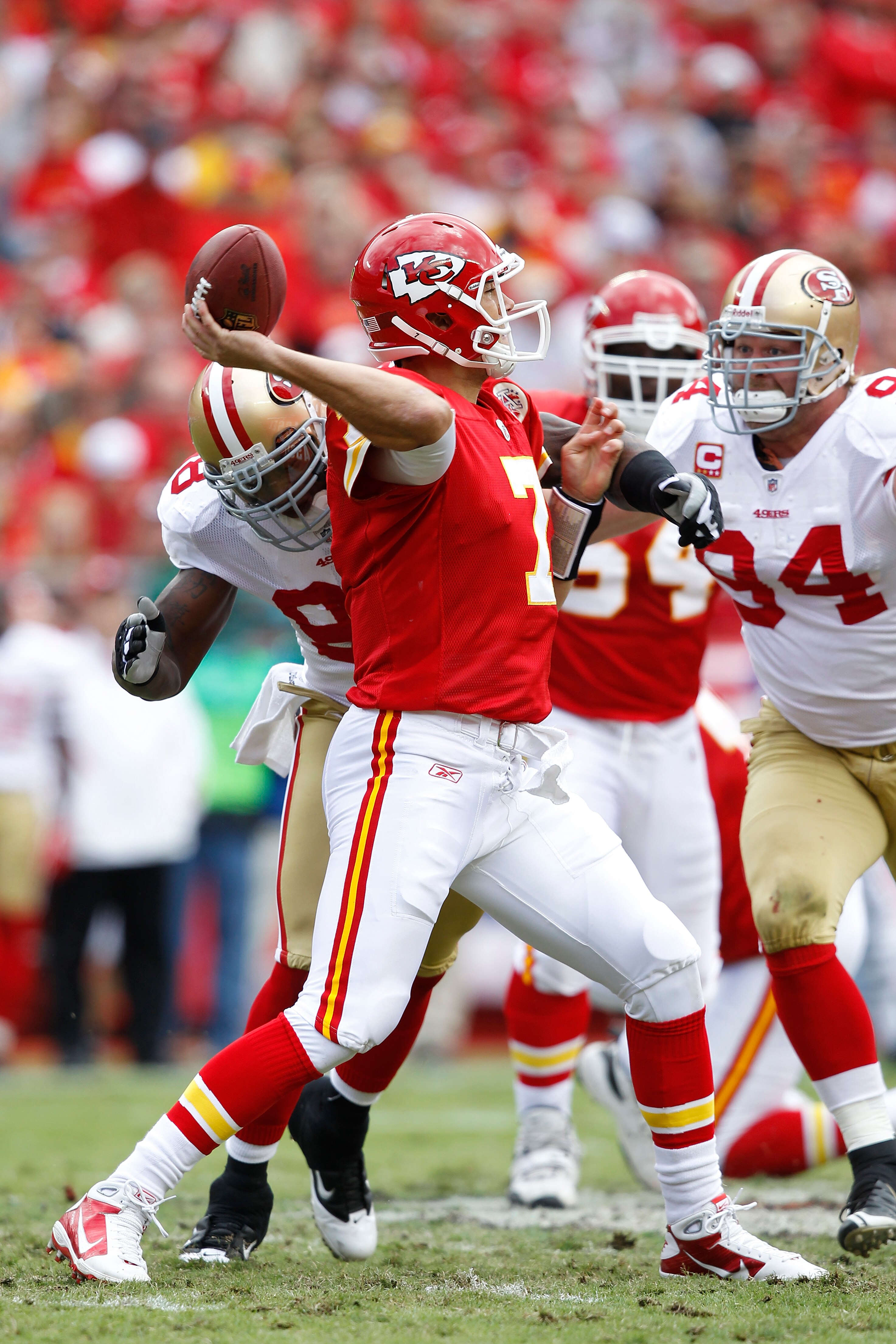 KANSAS CITY, MO - SEPTEMBER 26: Matt Cassel #7 of the Kansas City Chiefs passes the ball while under pressure from Justin Smith #94 and Parys Haralson #98 of the San Francisco 49ers at Arrowhead Stadium on September 26, 2010 in Kansas City, Missouri. The
