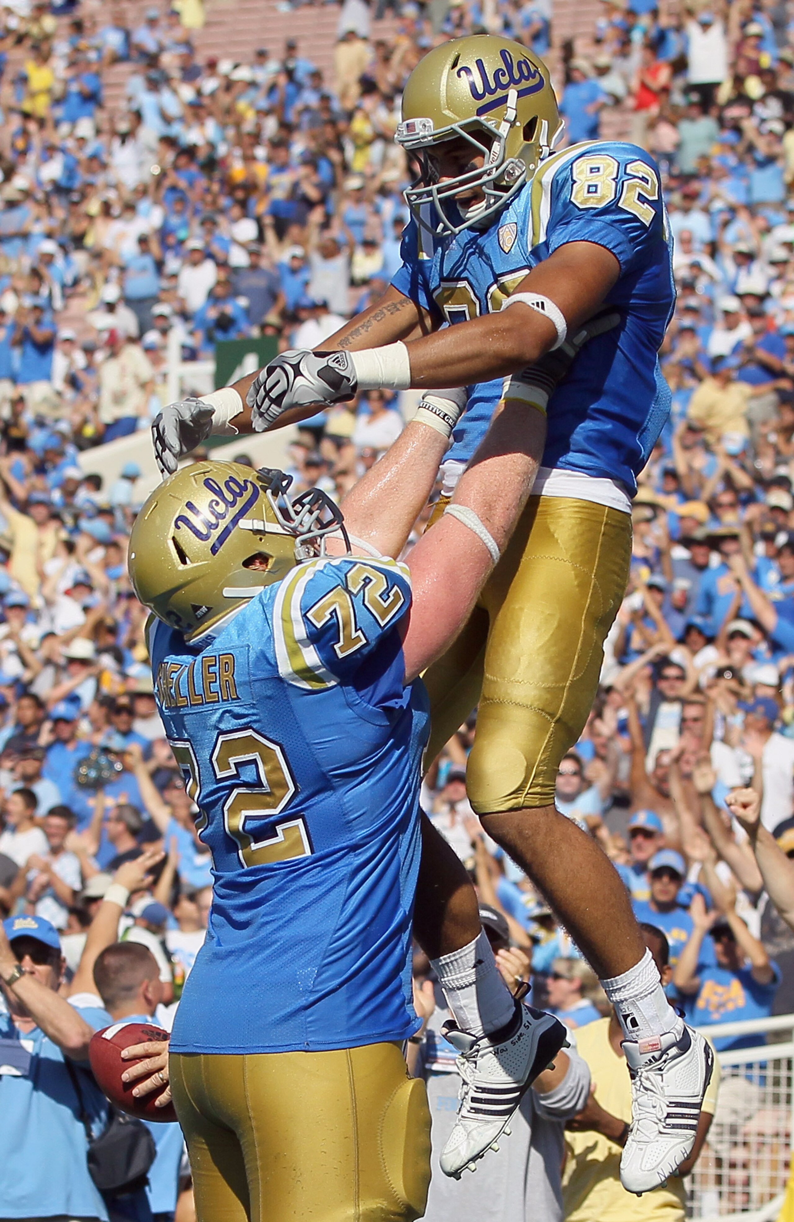 PASADENA, CA - OCTOBER 02:  Sean Sheller #72 and  Taylor Embree #82 of the UCLA Bruins celebrate Embree's two-point conversion against the Washington State Cougars during the third quarter at the Rose Bowl on October 2, 2010 in Pasadena, California. UCLA
