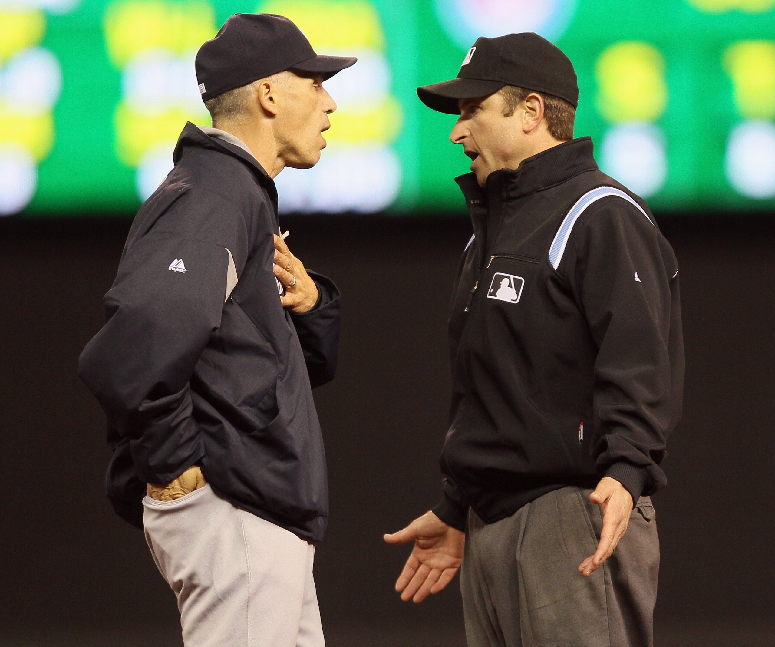 MINNEAPOLIS - OCTOBER 06:  Manager Joe Girardi of the New York Yankees argues with one of the umpires that Greg Golson made the catch for theout in the ninth inning against the Minnesota Twins the during game one of the ALDS on October 6, 2010 at Target F
