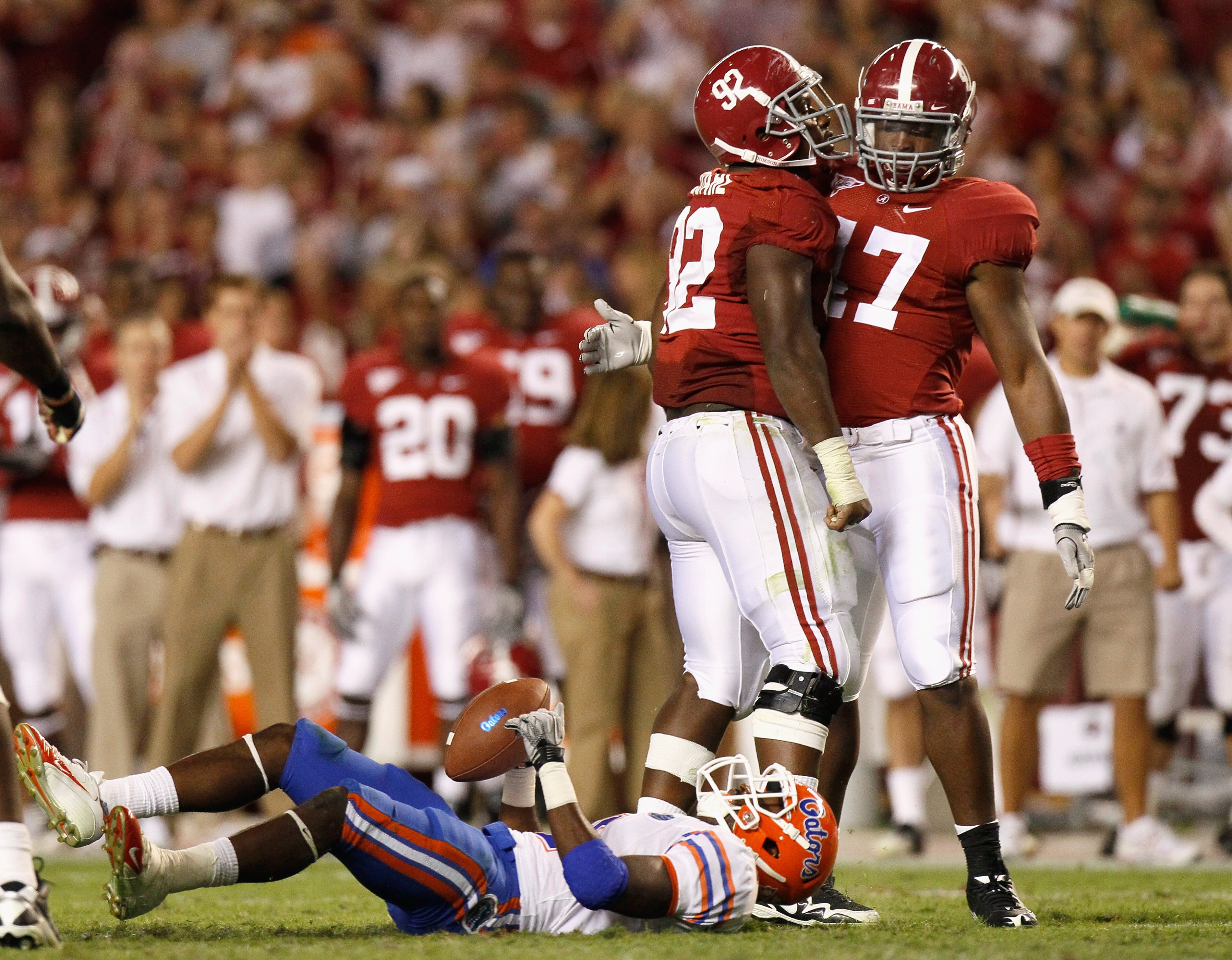 TUSCALOOSA, AL - OCTOBER 02:  Ed Stinson #47 and Damion Square #92 of the Alabama Crimson Tide celebrate after tackling Jeffery Demps #2 of the Florida Gators at Bryant-Denny Stadium on October 2, 2010 in Tuscaloosa, Alabama.  (Photo by Kevin C. Cox/Getty