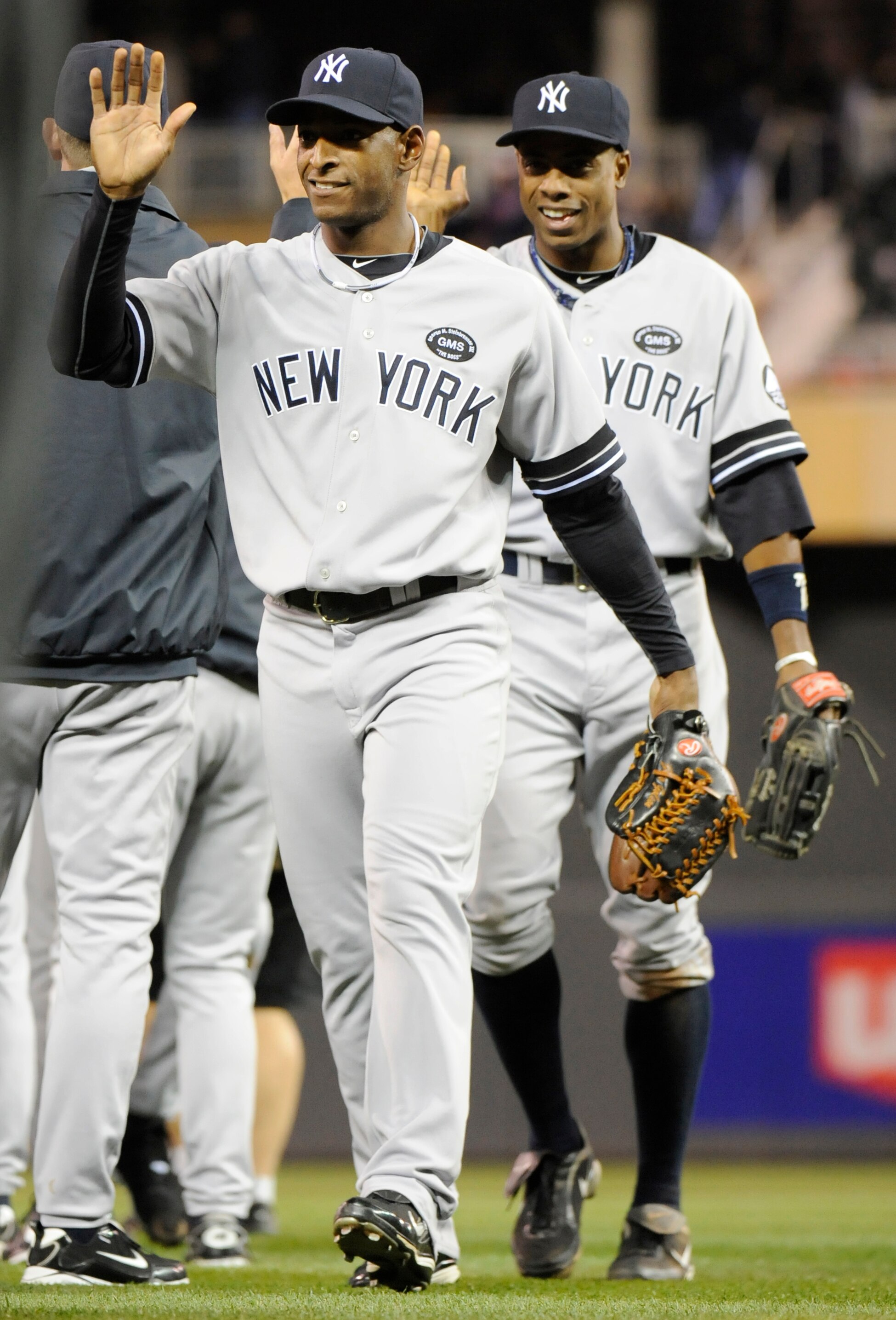 MINNEAPOLIS, MN - OCTOBER 6: Greg Golson #27 and Curtis Granderson #14 of the New York Yankees celebrate a 6-4 win against the Minnesota Twins following game one of the ALDS on October 6, 2010 at Target Field in Minneapolis, Minnesota. (Photo by Hannah Fo