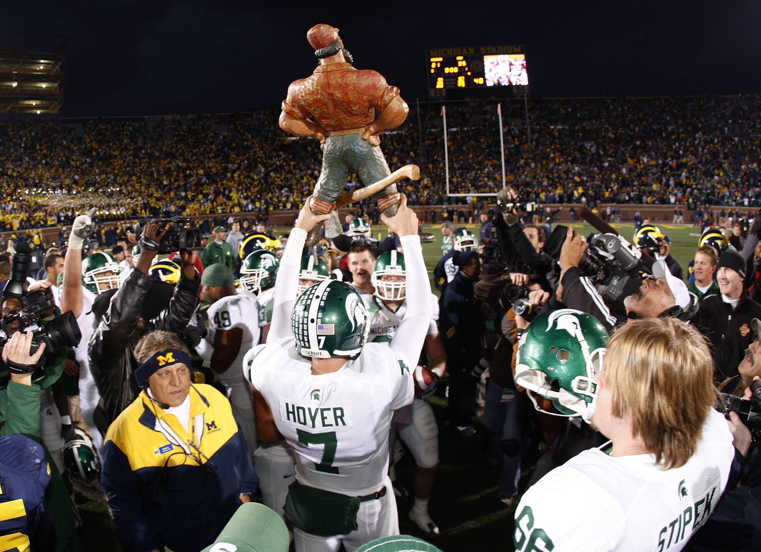 ANN ARBOR, MI - OCTOBER 25:  Brian Hoyer #7 of the Michigan State Spartans holds up the Paul Bunyan trophy after beating the Michigan Wolverines 35-21 on October 25, 2008 at Michigan Stadium in Ann Arbor, Michigan.  (Photo by Gregory Shamus/Getty Images)