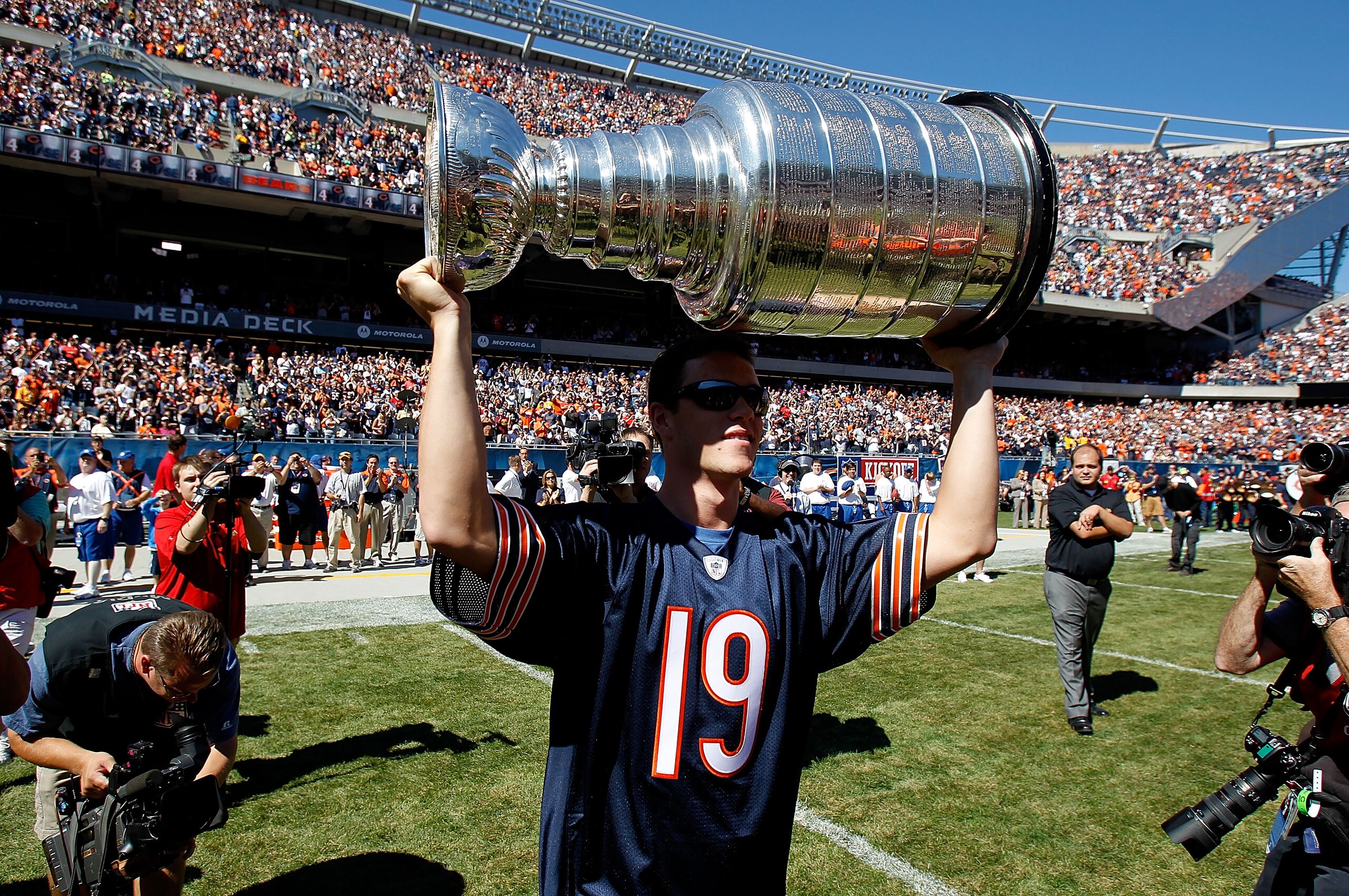 CHICAGO - SEPTEMBER 12: Jonathan Toews of the Chicago Blackhawks carries the Stanley Cup to the field before the NFL opening season game between the Chicago Bears and the Detroit Lions at Soldier Field on September 12, 2010 in Chicago, Illinois. The Bea CHICAGO - SEPTEMBER 12: Jonathan Toews of the Chicago Blackhawks carries the Stanley Cup to the field before the NFL opening season game between the Chicago Bears and the Detroit Lions at Soldier Field on September 12, 2010 in Chicago, Illinois. The Bea