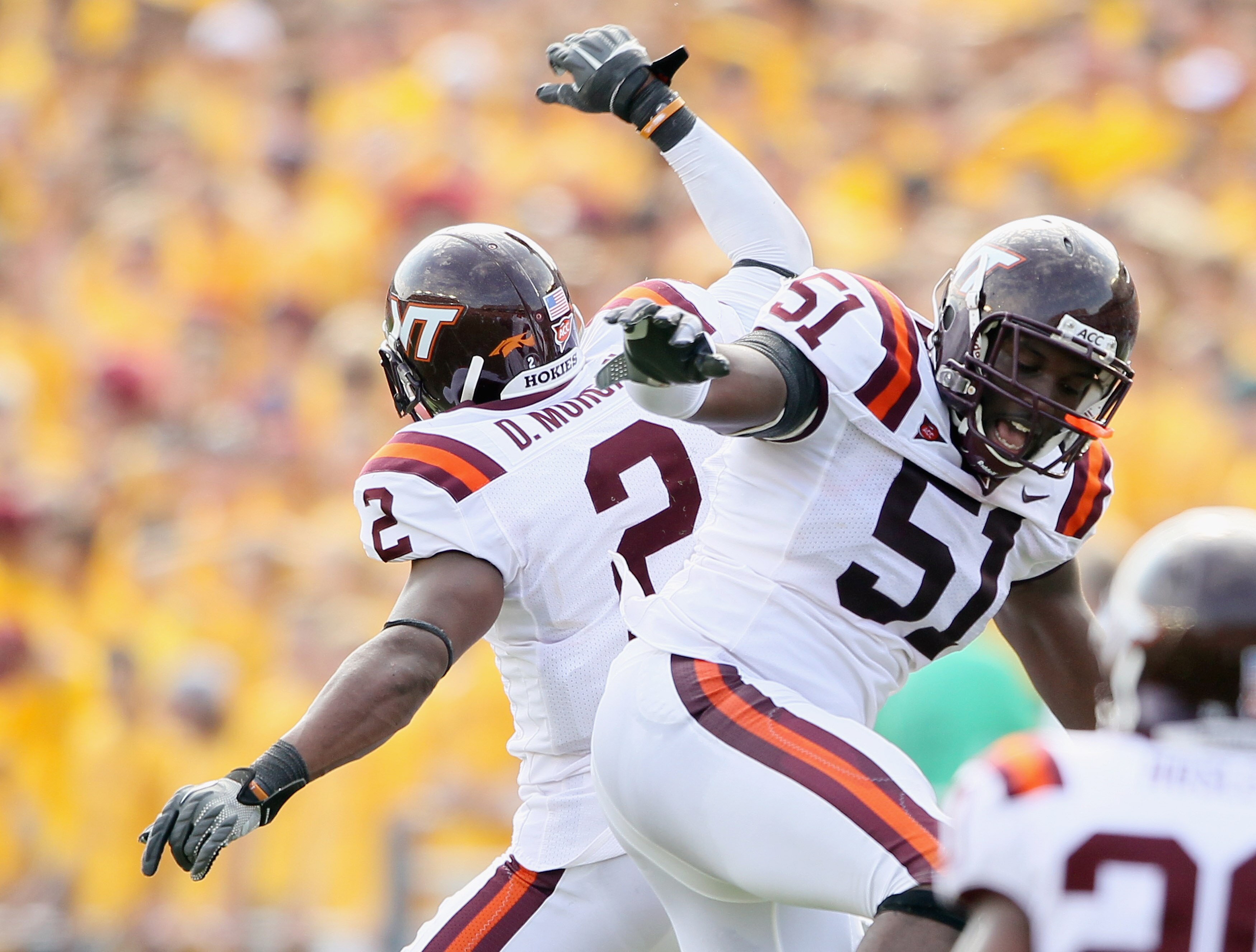 CHESTNUT HILL, MA - SEPTEMBER 25:  Devon Morgan #2 and Bruce Taylor #51 of the Virginia Tech Hokies celebrate the end of the first half against the Boston Collge Eagles on September 25, 2010 at Alumni Stadium in Chestnut Hill, Massachusetts.  (Photo by El
