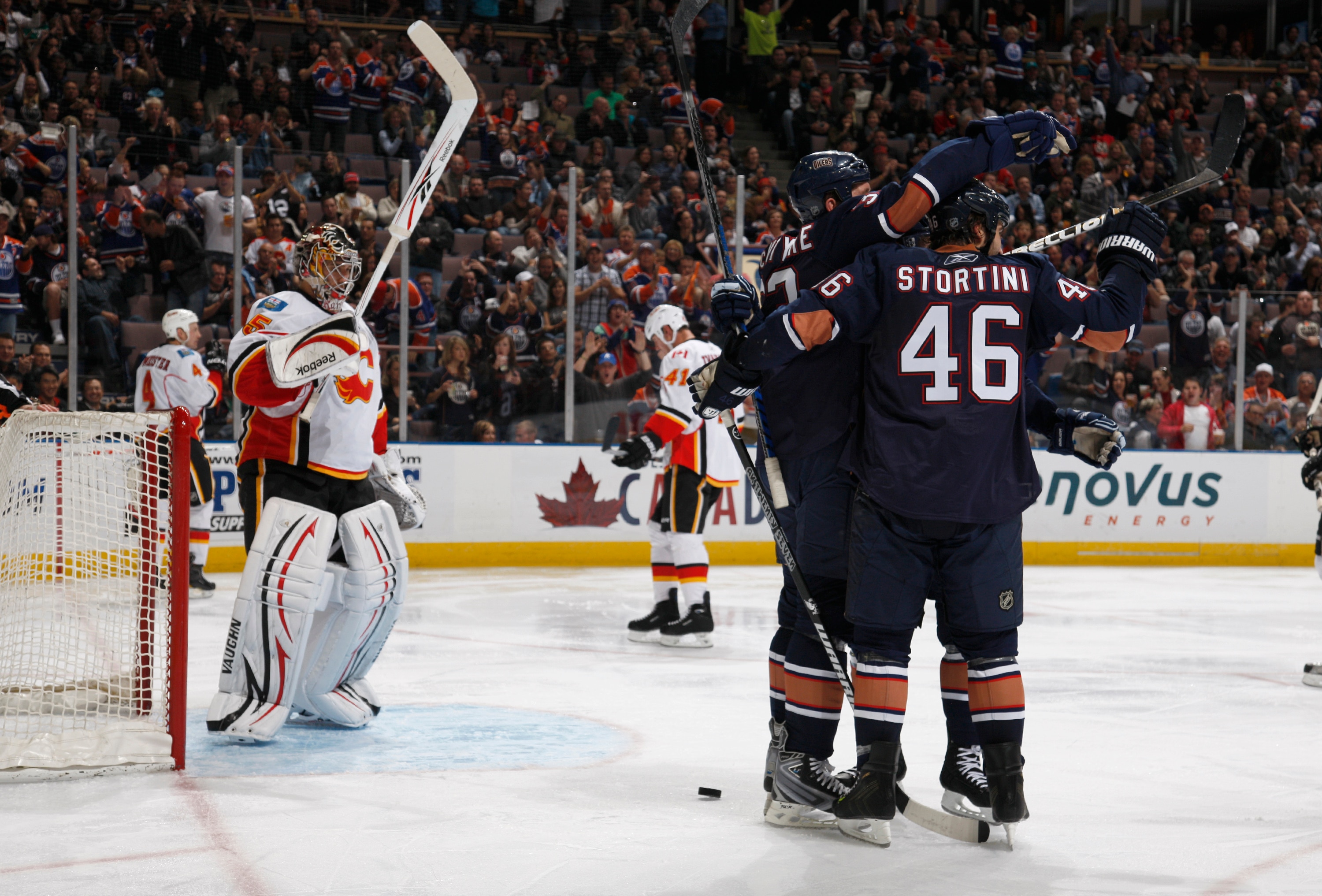 EDMONTON, CANADA - OCTOBER 1:  Steve MacIntyre #33 and Zack Stortini #46 of the Edmonton Oilers celebrate MacIntyre's goal on Henrik Karlsson #35 of the Calgary Flames in second-period action at Rexall Place October 1, 2010 in Edmonton, Alberta, Canada. (