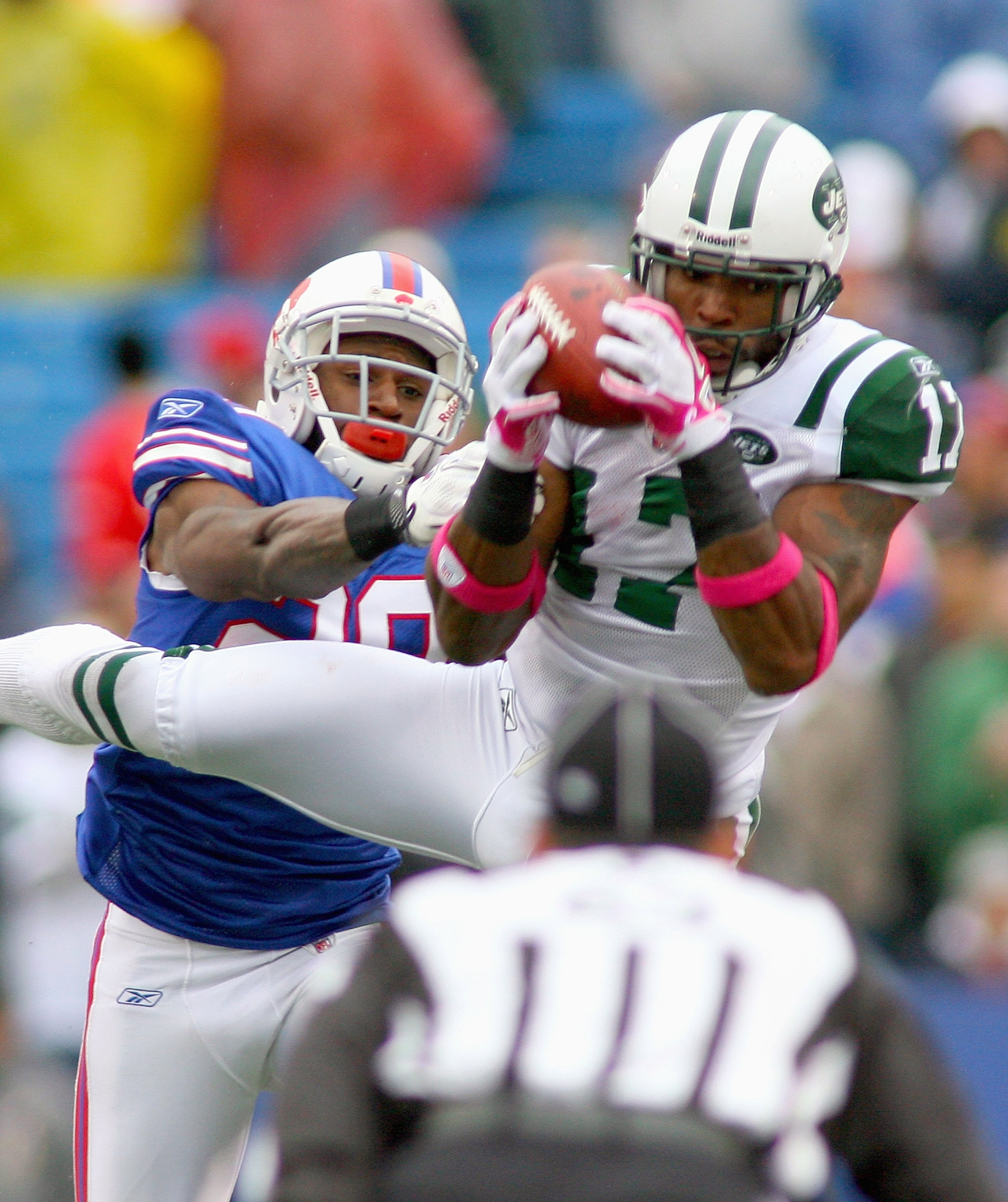 ORCHARD PARK, NY - OCTOBER 03:  Braylon Edwards #17  of the New York Jets makes a catch over Drayton Florence #29 of  the Buffalo Bills at Ralph Wilson Stadium on October 3, 2010 in Orchard Park, New York. The Jets won 38-14.  (Photo by Rick Stewart/Getty