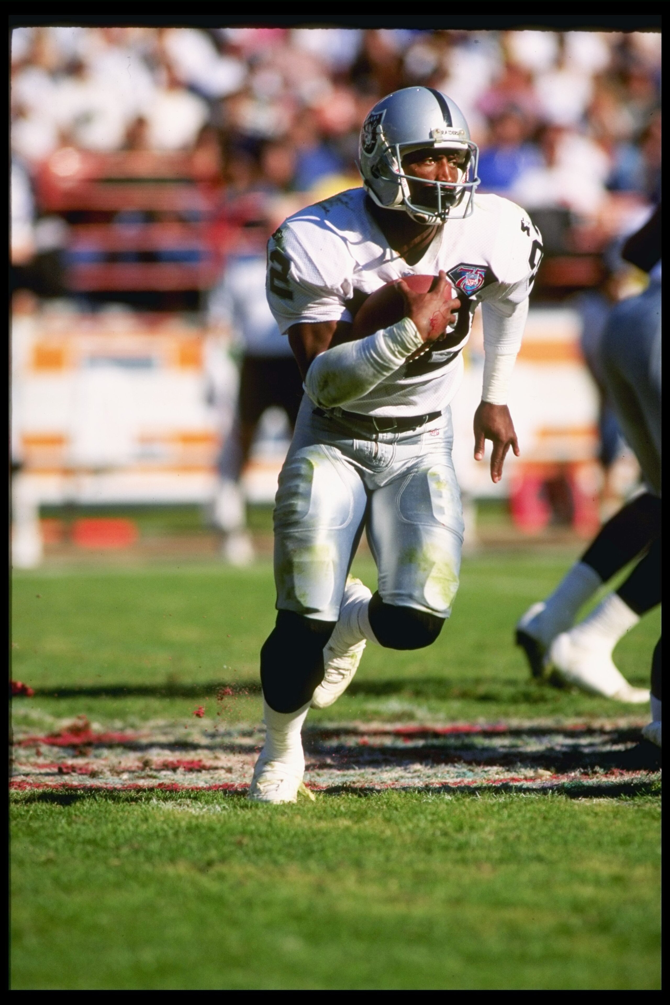 13 Nov 1994: Running back Harvey William of the Los Angeles Raiders runs down the field during a game against the Los Angeles Rams at Anaheim Stadium in Anaheim, California. The Raiders won the game 20-17.