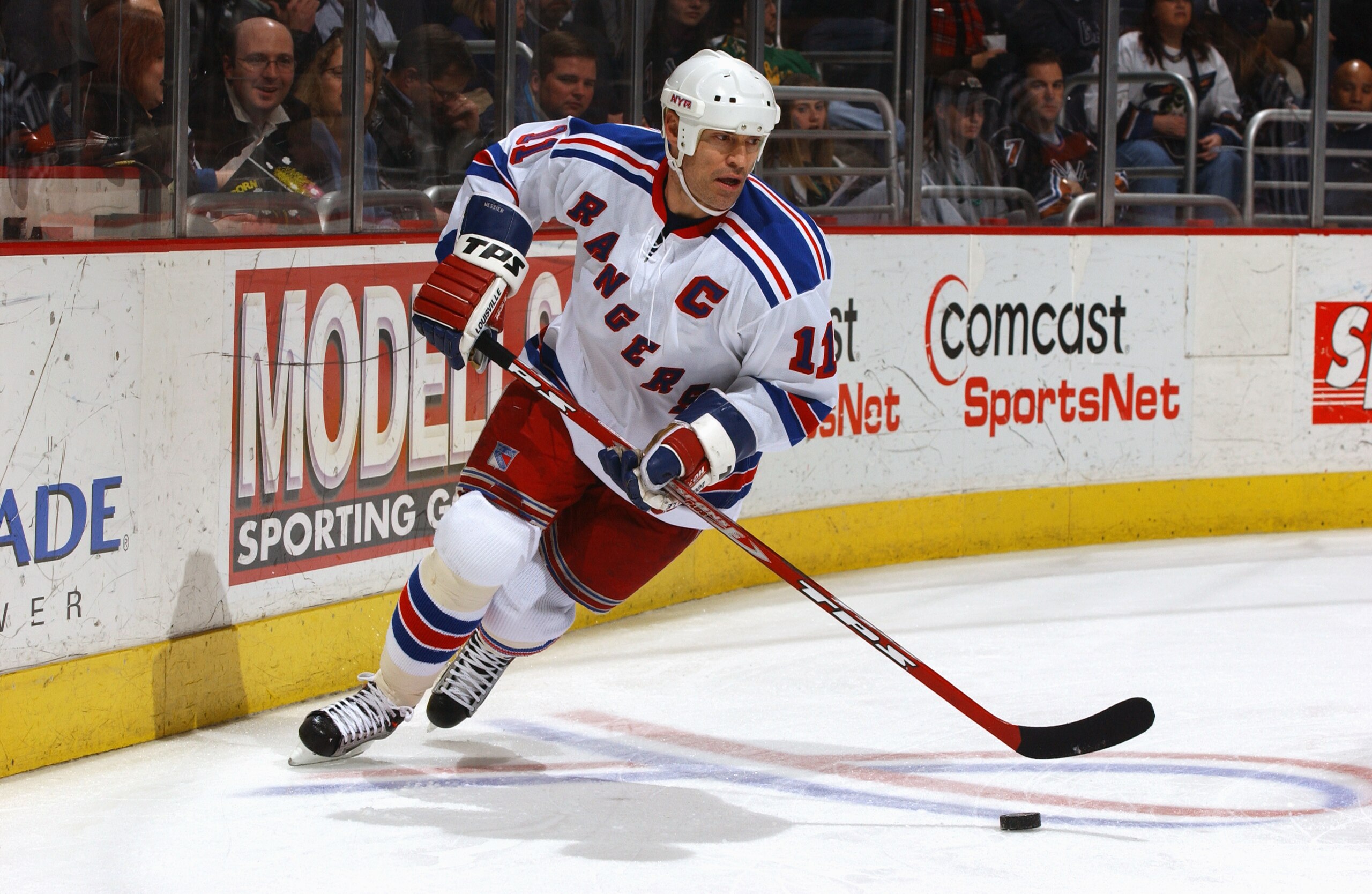 WASHINGTON - MARCH 18:  Center Mark Messier #11 of the New York Rangers advances the puck during the game against the Washington Capitals at the MCI Center on March 18, 2004 in Washington, DC. The Capitals defeated the Rangers 4-3 in overtime. (Photo by M