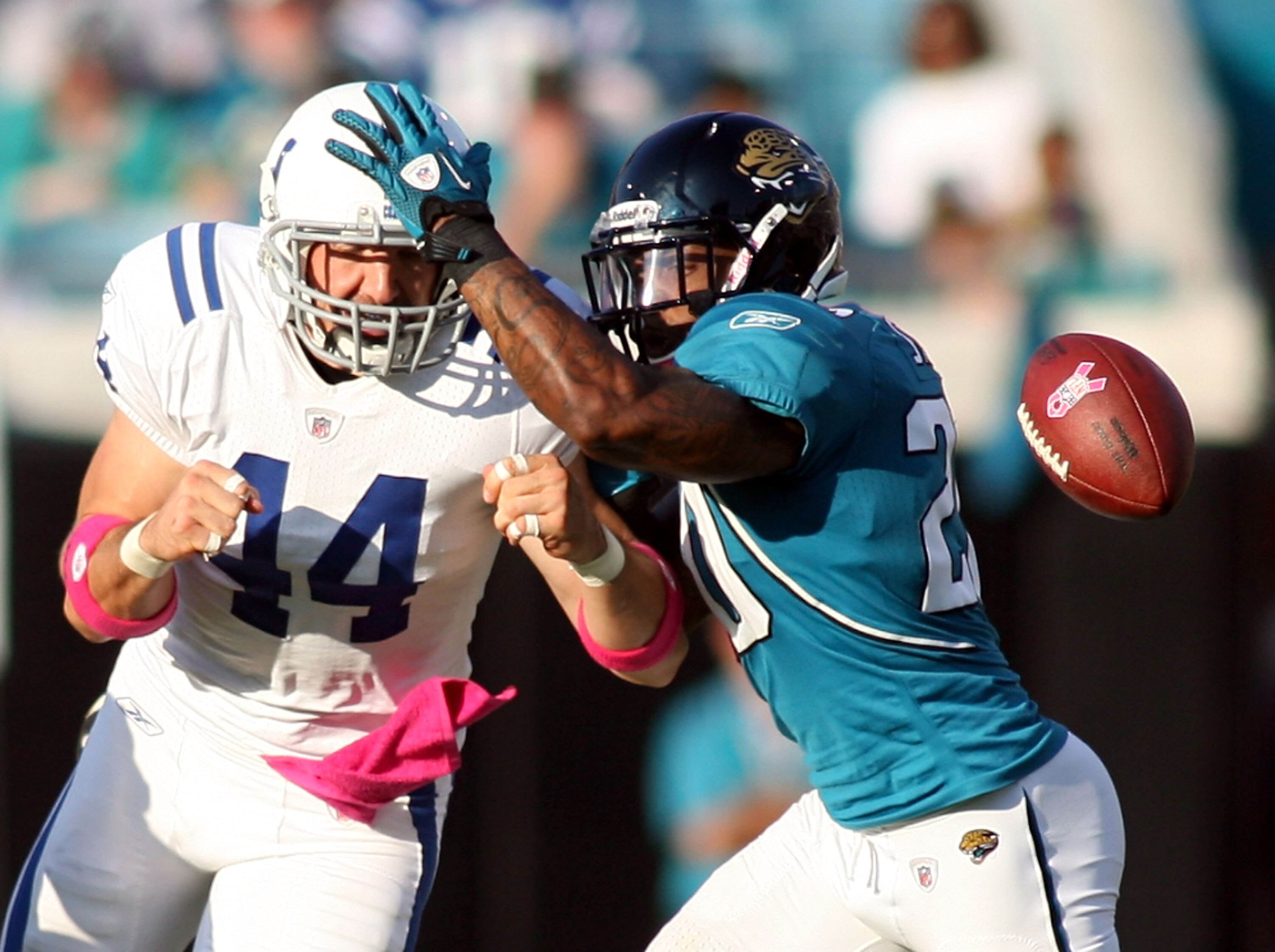 JACKSONVILLE, FL - OCTOBER 03:  Tight end Dallas Clark #44 of the Indianapolis Colts cannot hold onto a pass as he is defended by Anthony Smith #20 of the Jacksonville Jaguars at EverBank Field on October 3, 2010 in Jacksonville, Florida.  (Photo by Marc