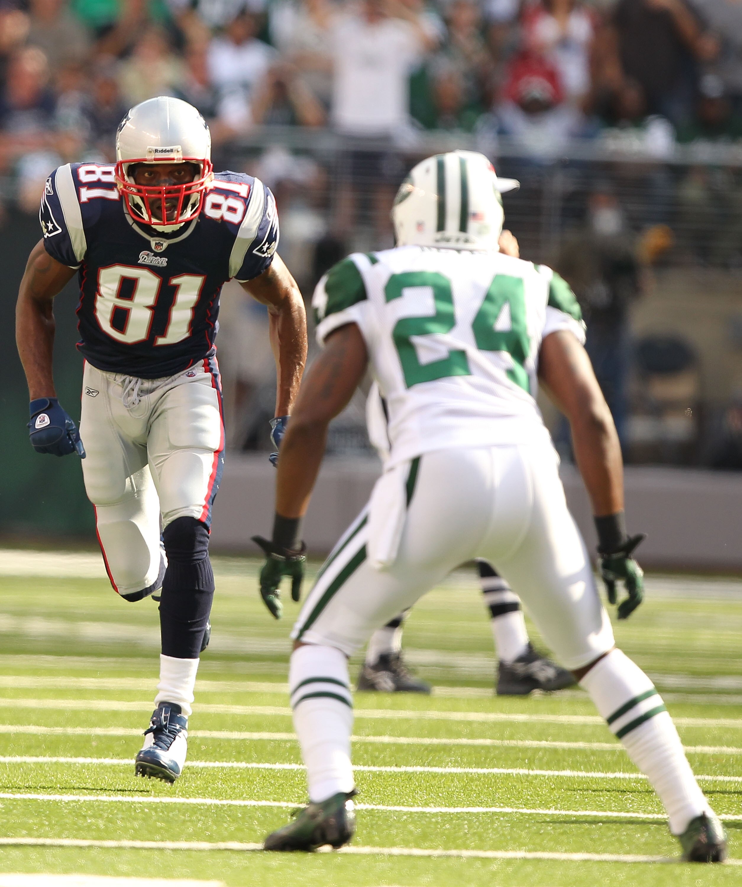 EAST RUTHERFORD, NJ - SEPTEMBER 19:  Darrelle Revis #24 of the New York Jets defends against Randy Moss #81 of the New England Patriots during their  game on September 19, 2010 at the New Meadowlands Stadium  in East Rutherford, New Jersey.  (Photo by Al 