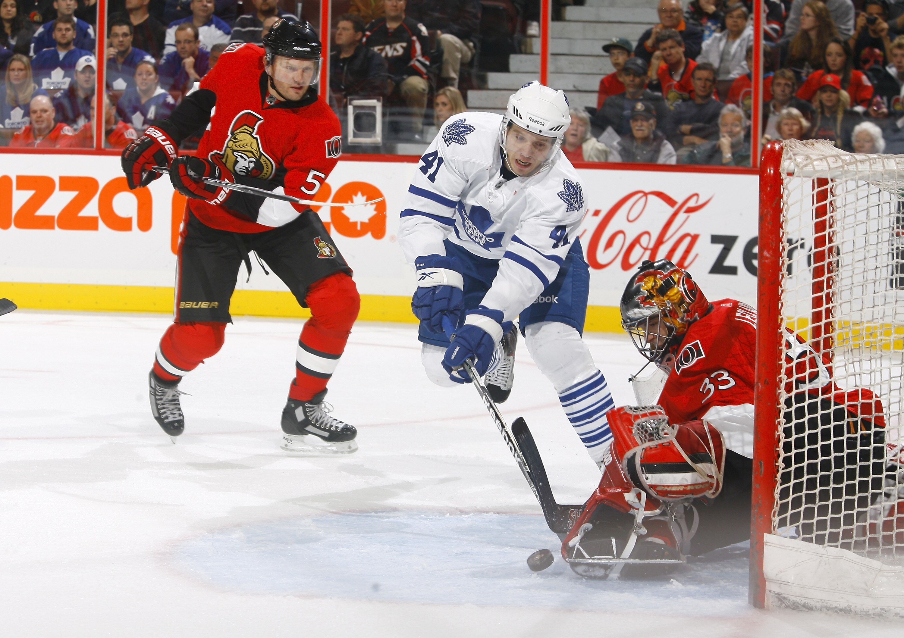 KANATA, ON - SEPTEMBER 29:  Pascal Leclaire #33 of the Ottawa Senators makes a pad save off a point blank attempt by Nikolai Kulemin #41 of the Toronto Maple Leafs during a game at Scotiabank Place on September 29, 2010 in Kanata, Canada.  (Photo by Phill