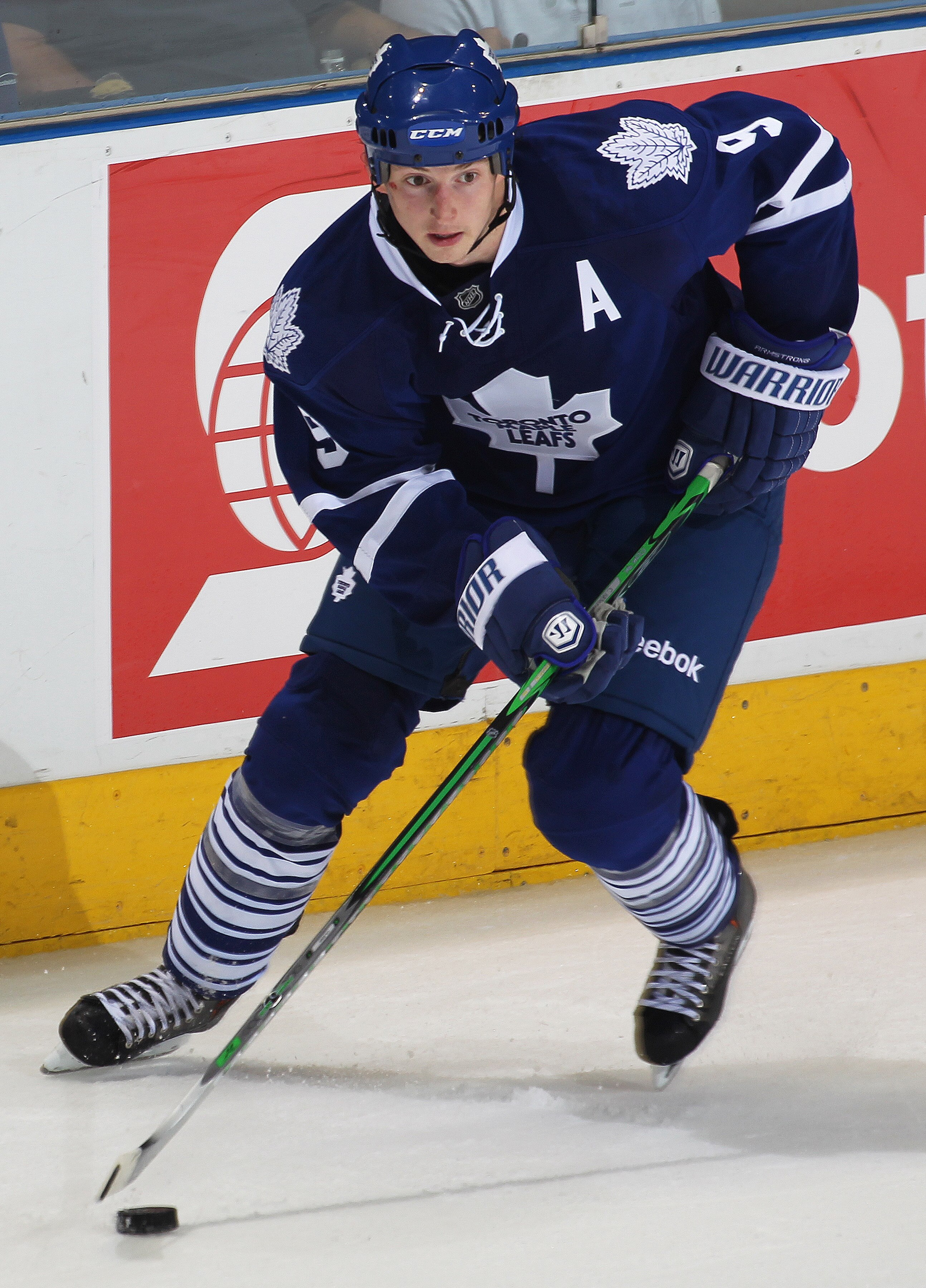 LONDON,ON - SEPTEMBER 23: Colby Armstrong #9 of the Toronto Maple Leafs skates with the puck in a pre-season game against the Philadelphia Flyers on September 23,2010 at the John Labatt Centre in London, Ontario. The Leafs defeated the Flyers 3-2 in a sho
