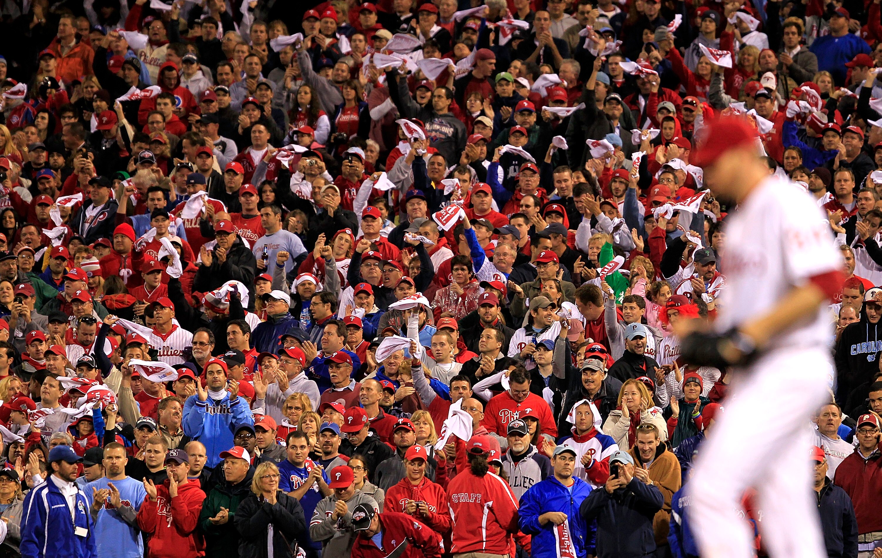 PHILADELPHIA - OCTOBER 06:  Fans cheer Roy Halladay #34 of the Philadelphia Phillies during Game 1 of the NLDS against the Cincinnati Reds at Citizens Bank Park on October 6, 2010 in Philadelphia, Pennsylvania.  (Photo by Chris Trotman/Getty Images)