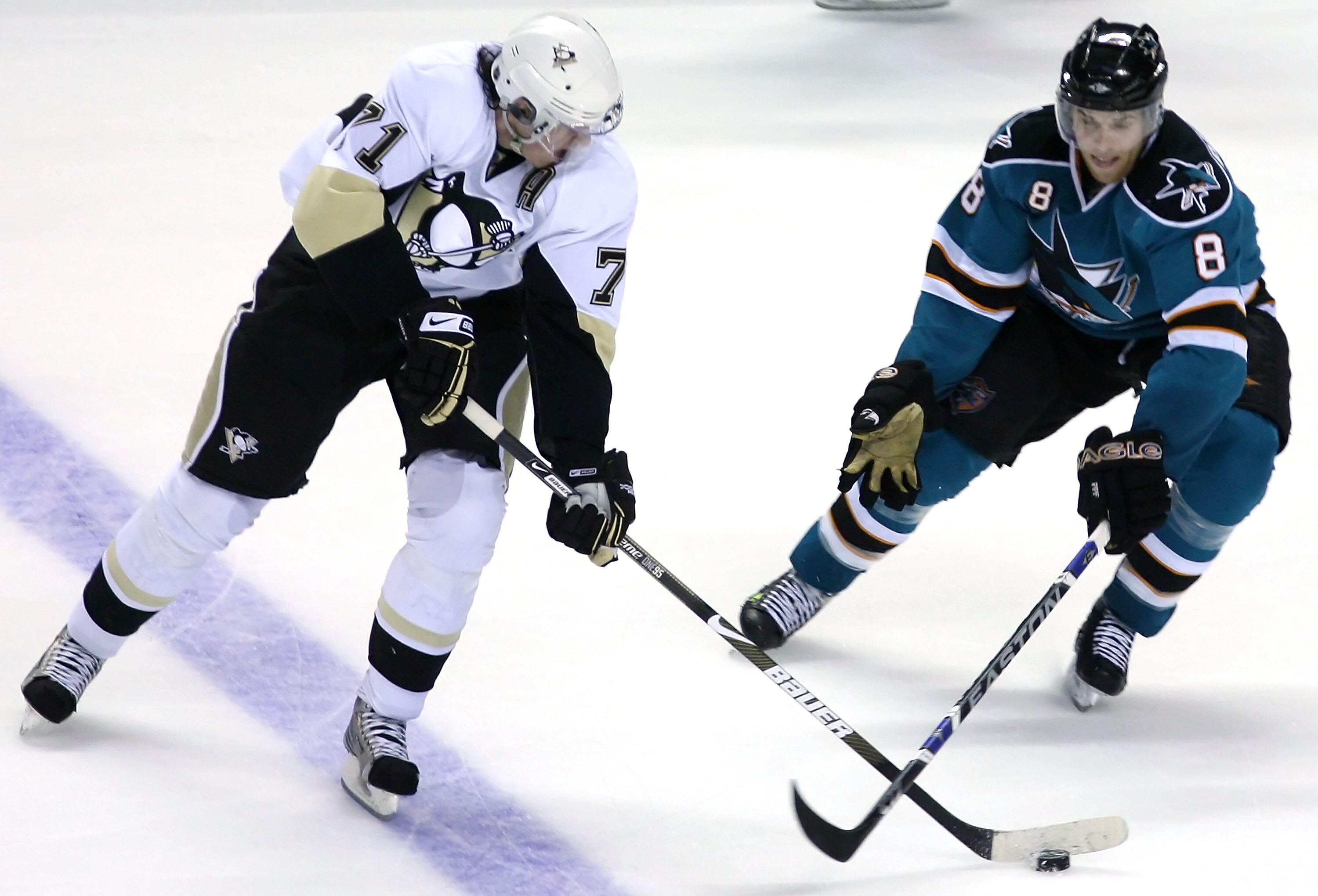 SAN JOSE, CA - OCTOBER 28:  Evgeni Malkin #71 of the Pittsburgh Penguins handles the puck under pressure from Joe Pavelski #8 of the San Jose Sharks during the NHL game at HP Pavilion on October 28, 2008 in San Jose, California.  (Photo by Christian Peter