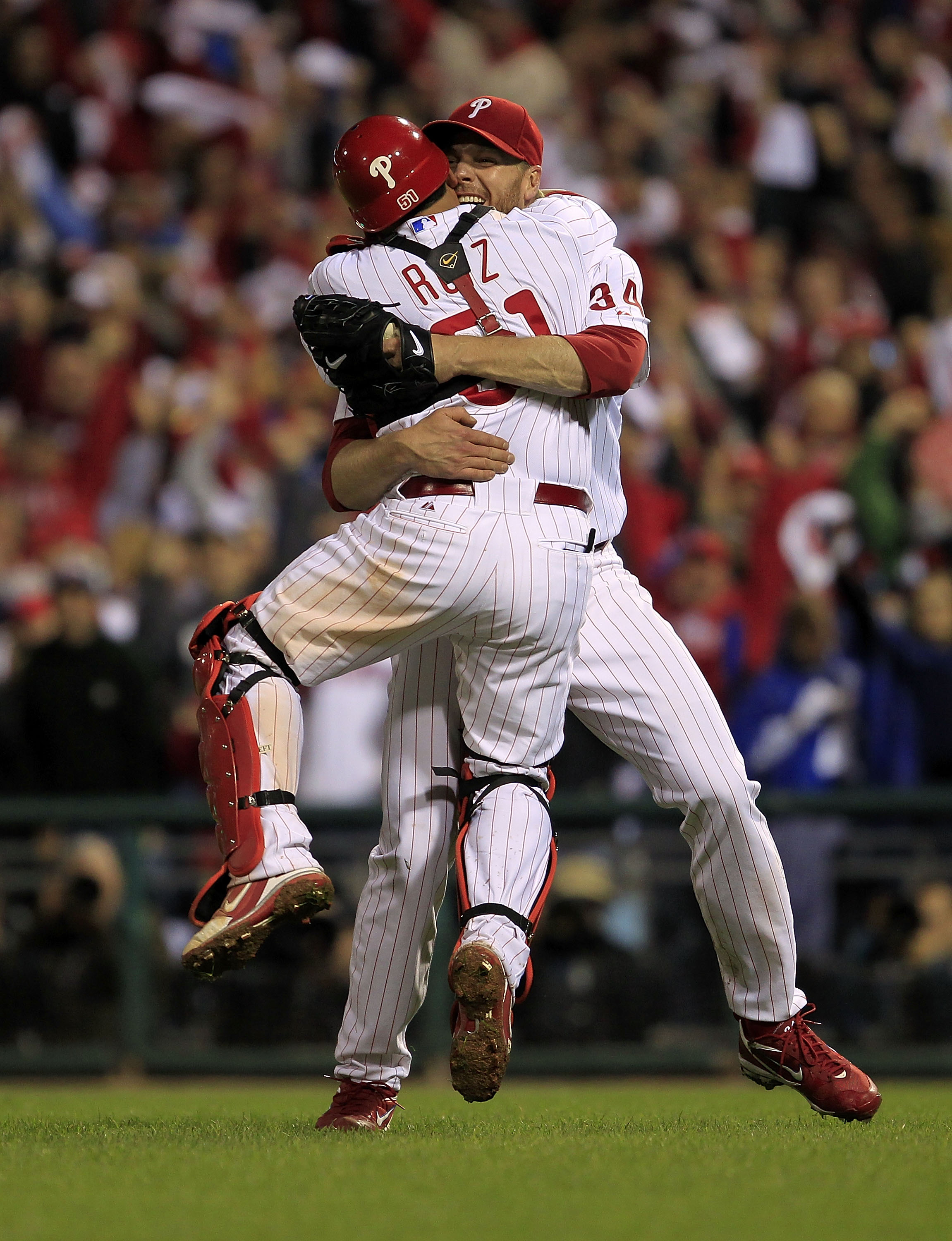PHILADELPHIA - OCTOBER 06:  Roy Halladay #34 and Carlos Ruiz #51 of the Philadelphia Phillies celebrate Halladay's no-hitter and the win in Game 1 of the NLDS against the Cincinnati Reds at Citizens Bank Park on October 6, 2010 in Philadelphia, Pennsylvan
